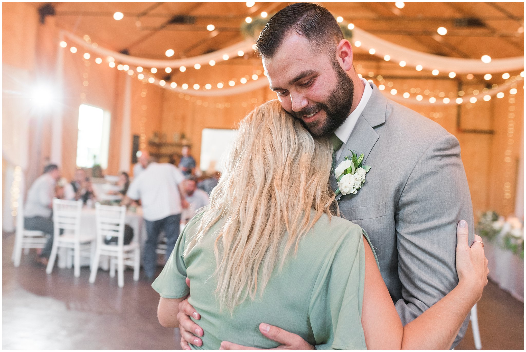 Mother son dance during Oak Hills wedding in the barn | Sage Green and Gray Summer Wedding at Oak Hills | Jessie and Dallin Photography