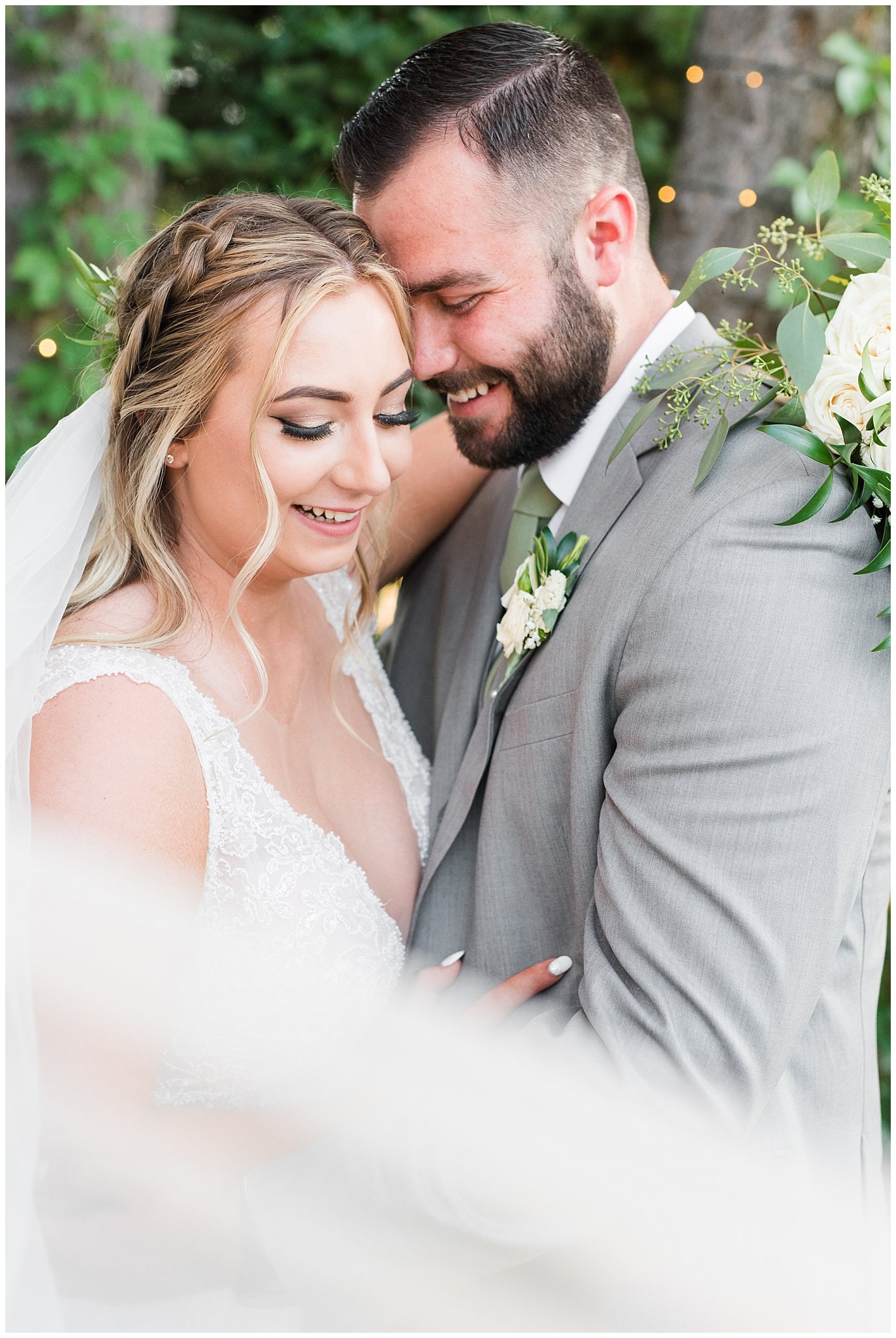 Bride and groom portraits with gray suit and champagne dress and veil and white floral bouquet in pine trees | Sage Green and Gray Summer Wedding at Oak Hills | Jessie and Dallin Photography