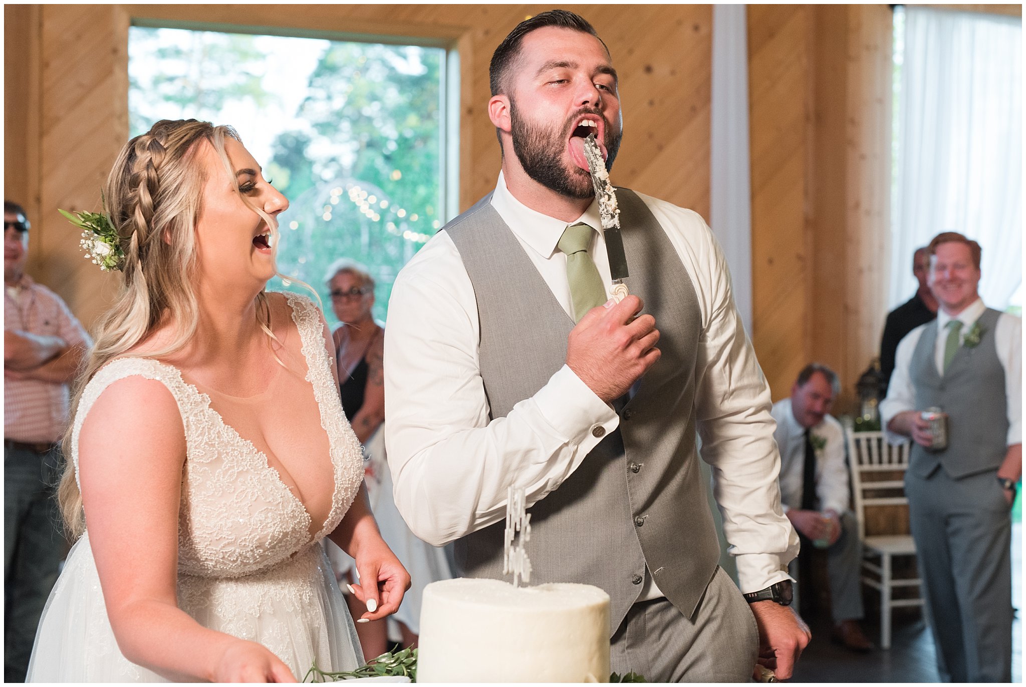 Cake cutting in bar with lots of emotion | Sage Green and Gray Summer Wedding at Oak Hills | Jessie and Dallin Photography