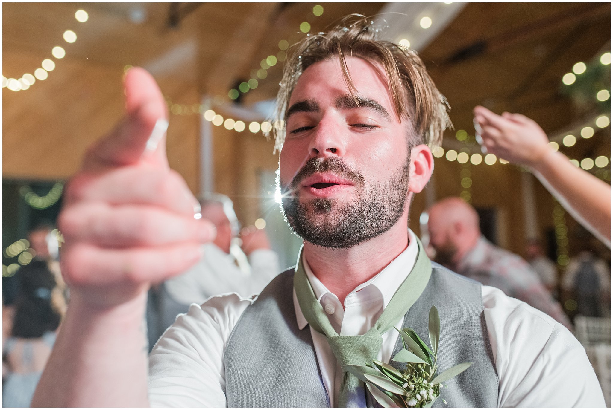 Party dancing in a barn during wedding reception | Sage Green and Gray Summer Wedding at Oak Hills | Jessie and Dallin Photography