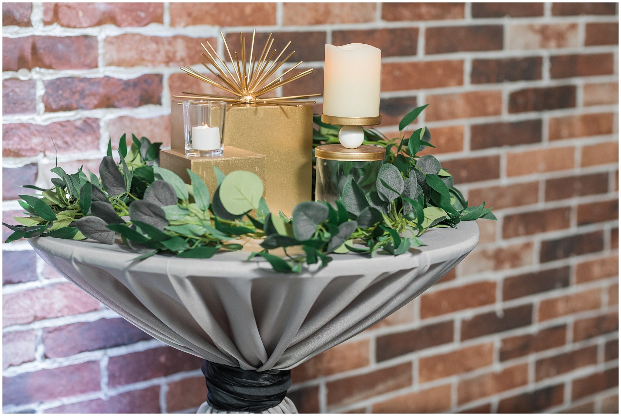 Decor on cocktail table in industrial brick wall | The Foundry | Utah Wedding Venue | Shout-out Saturday | Jessie and Dallin Photography