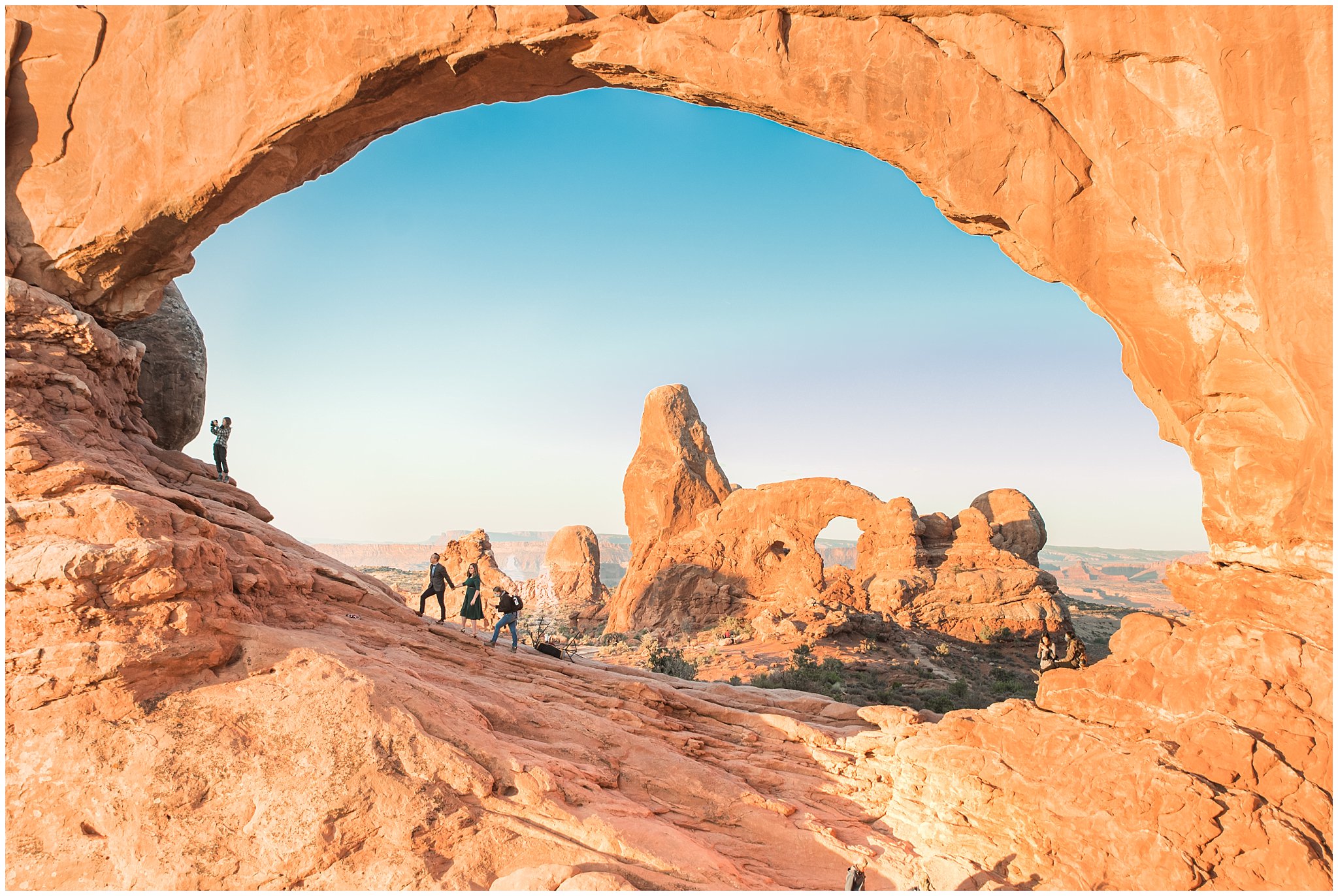 Jessie posing a couple in the crowds of Arches National Park