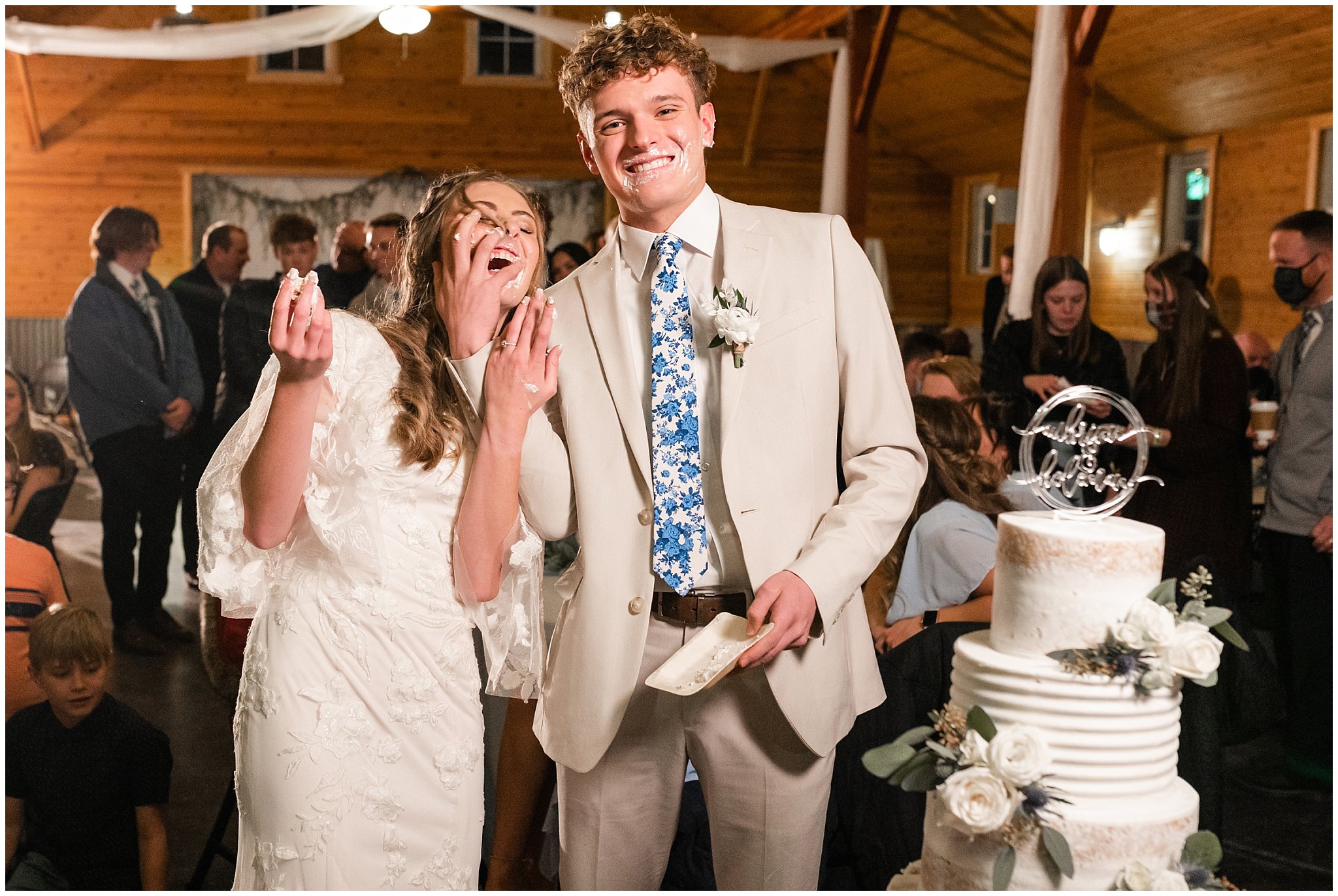 Bride and groom cake cutting and fun smash | Oquirrh Mountain Temple and Draper Day Barn Winter Wedding | Jessie and Dallin Photography