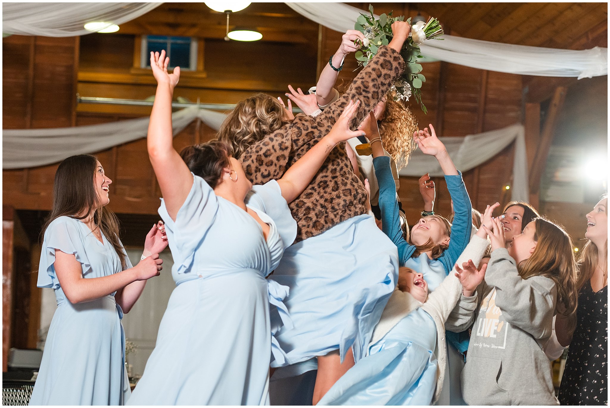 Bouquet toss at barn wedding | Oquirrh Mountain Temple and Draper Day Barn Winter Wedding | Jessie and Dallin Photography