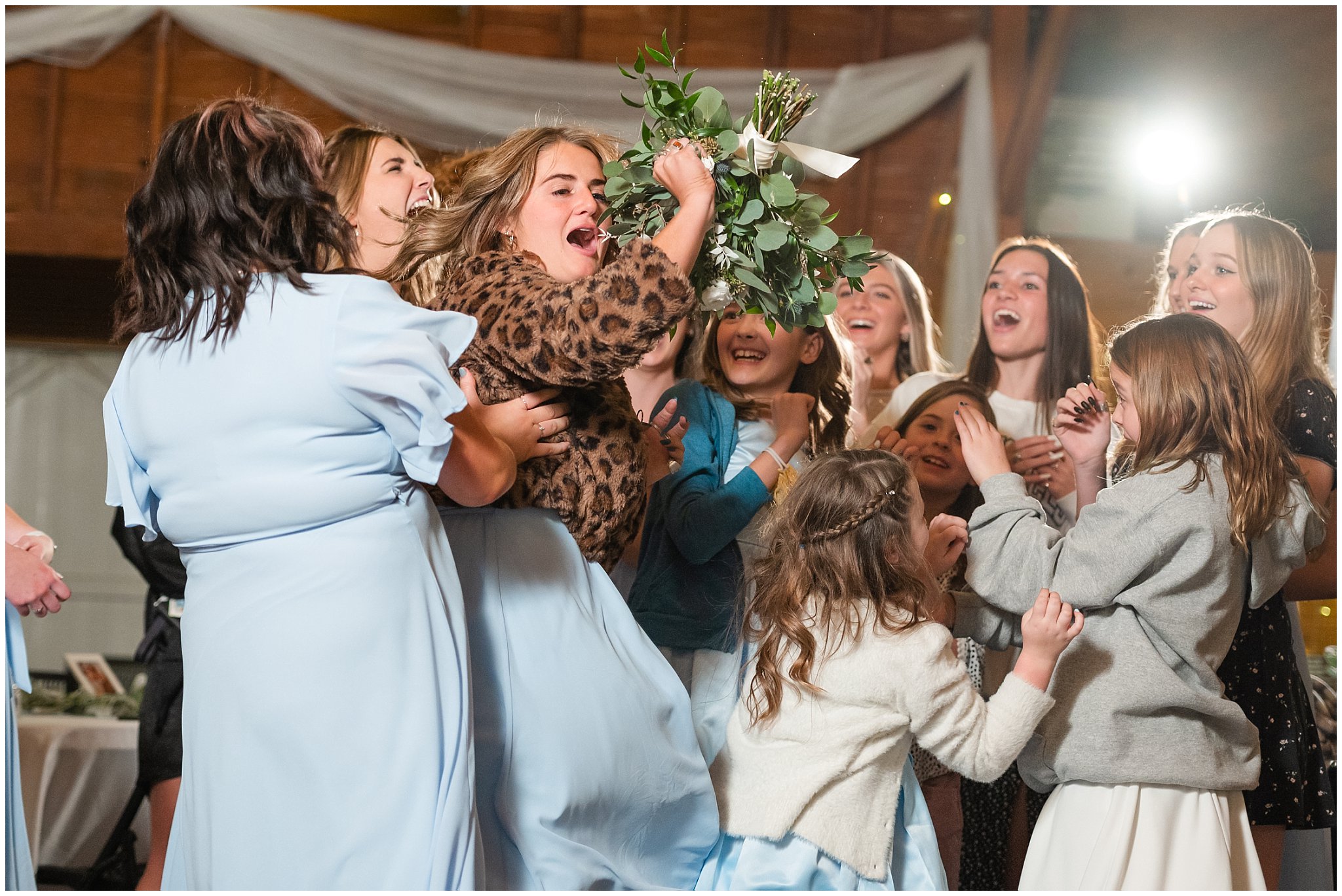 Bouquet toss at barn wedding | Oquirrh Mountain Temple and Draper Day Barn Winter Wedding | Jessie and Dallin Photography