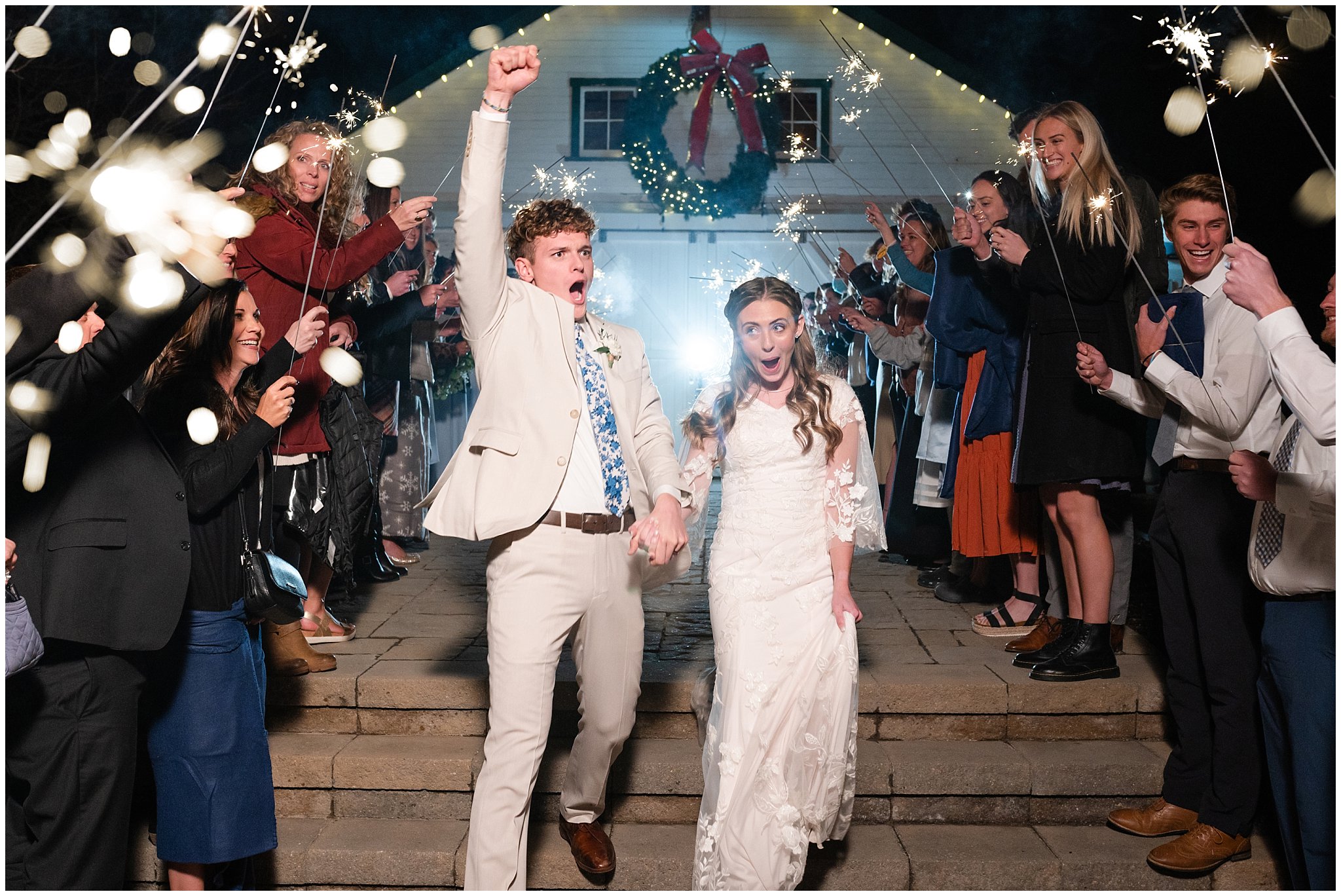 Fun and exciting sparkler exit during barn wedding | Oquirrh Mountain Temple and Draper Day Barn Winter Wedding | Jessie and Dallin Photography