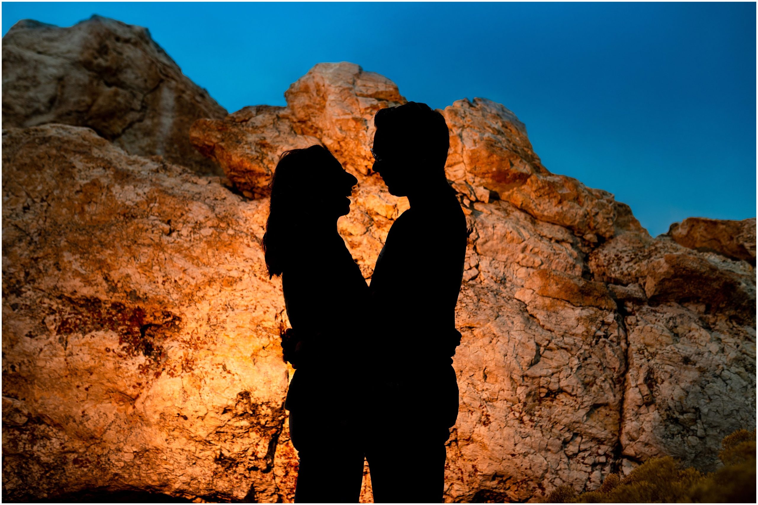 Silhouette on rocks | Antelope Island Stormy Engagement Session | Jessie and Dallin Photography