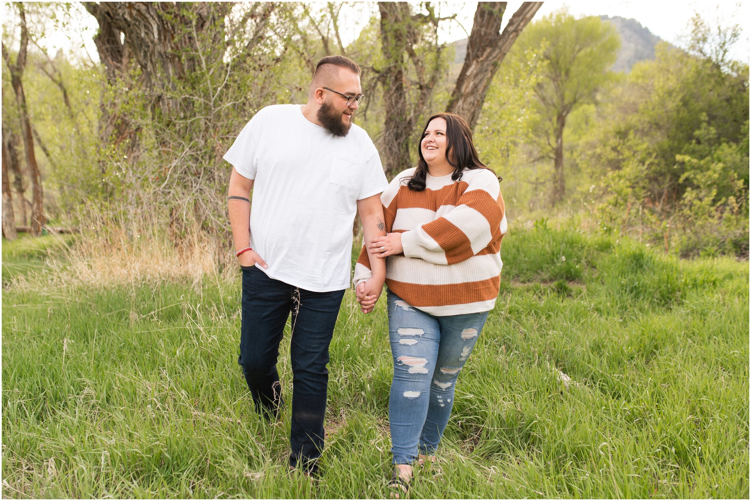 Couple in the woods and trees in causal outfit for Ogden Valley Summer Engagement Session