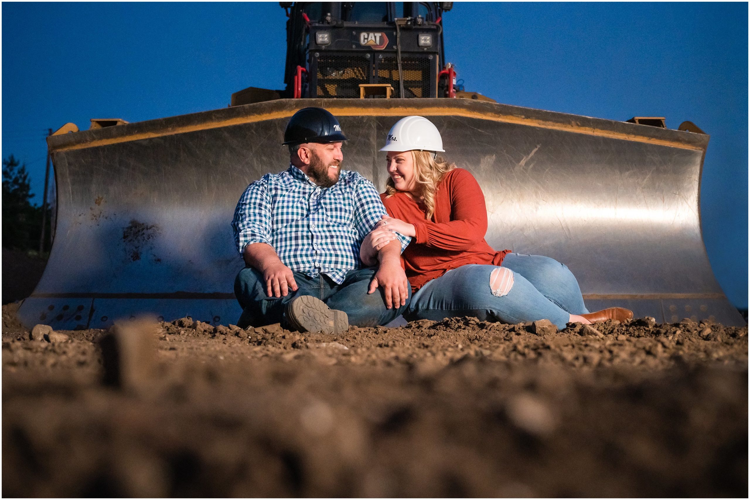 Couple in matching bride and groom construction helmets at construction site during Utah Mountain and Construction Site Engagement Session | Jessie and Dallin Photography
