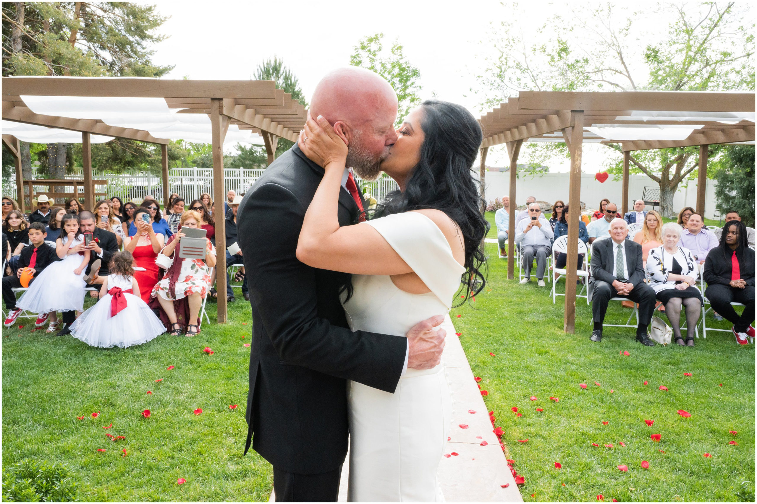 Wedding ceremony with red roses in aisle | Red and Black Oak Hills Utah Spring Wedding | Jessie and Dallin Photography