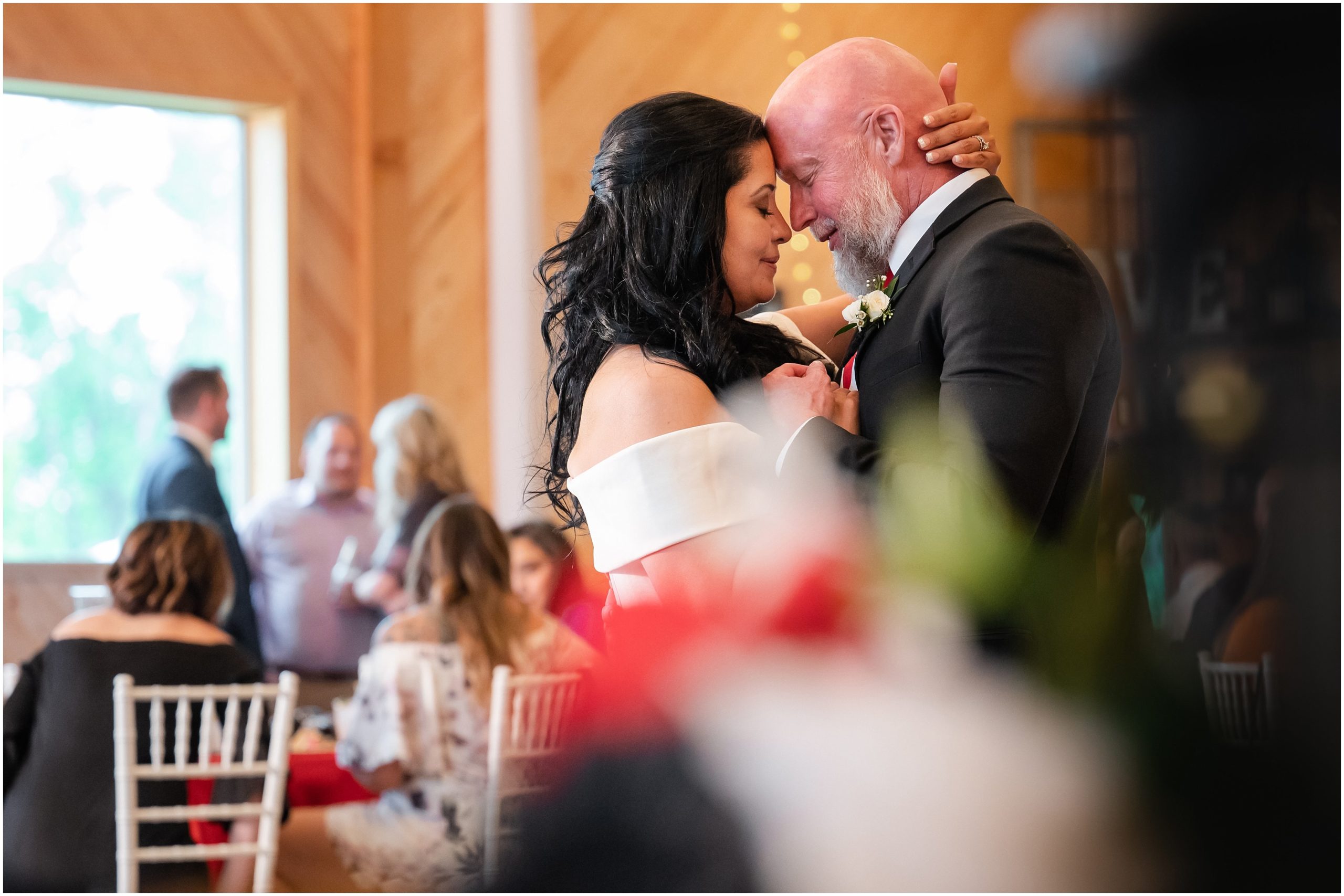 Bride and groom grand entrance and first dance in rustic barn | Red and Black Oak Hills Utah Spring Wedding | Jessie and Dallin Photography
