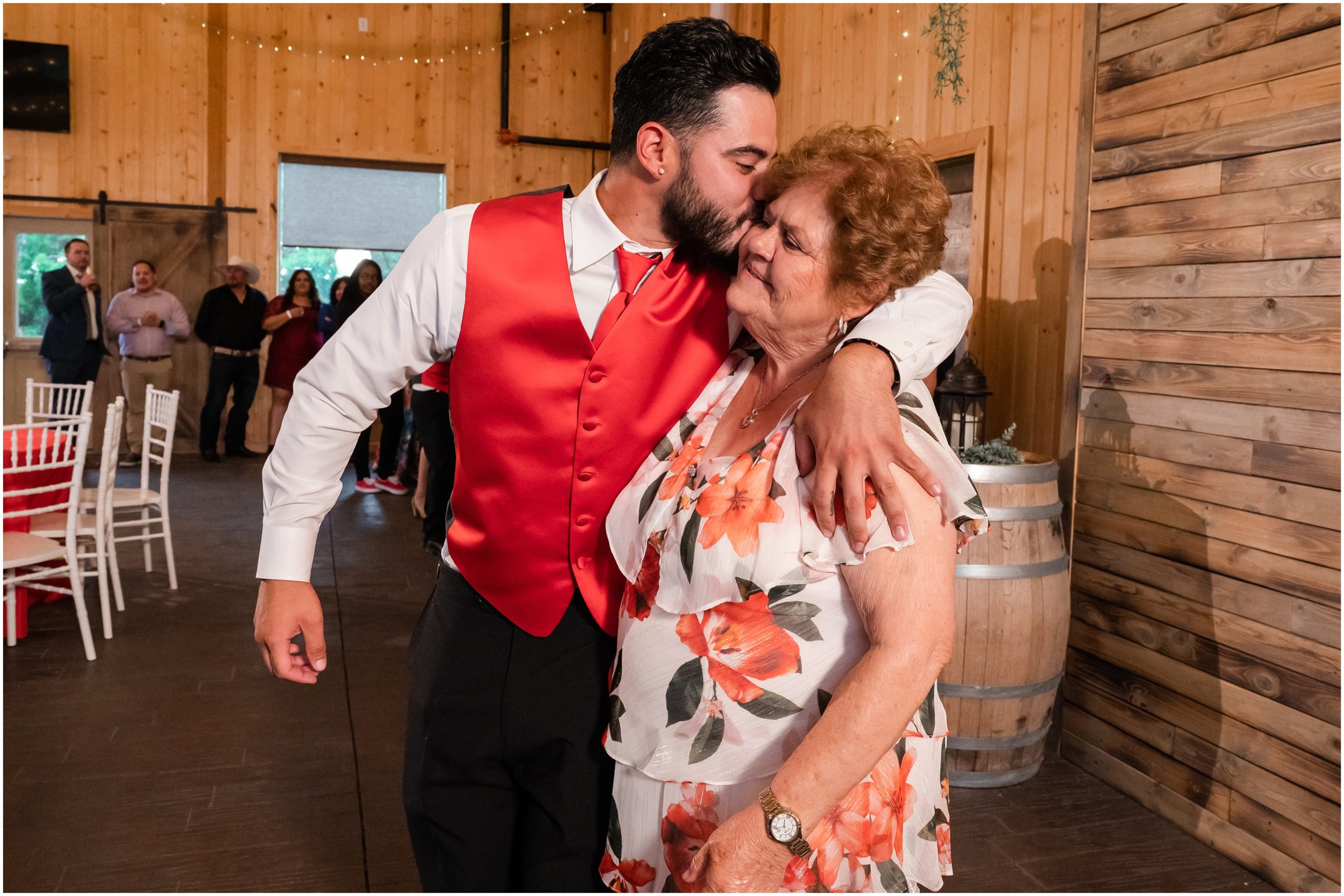 Group and party dancing in rustic barn | Red and Black Oak Hills Utah Spring Wedding | Jessie and Dallin Photography