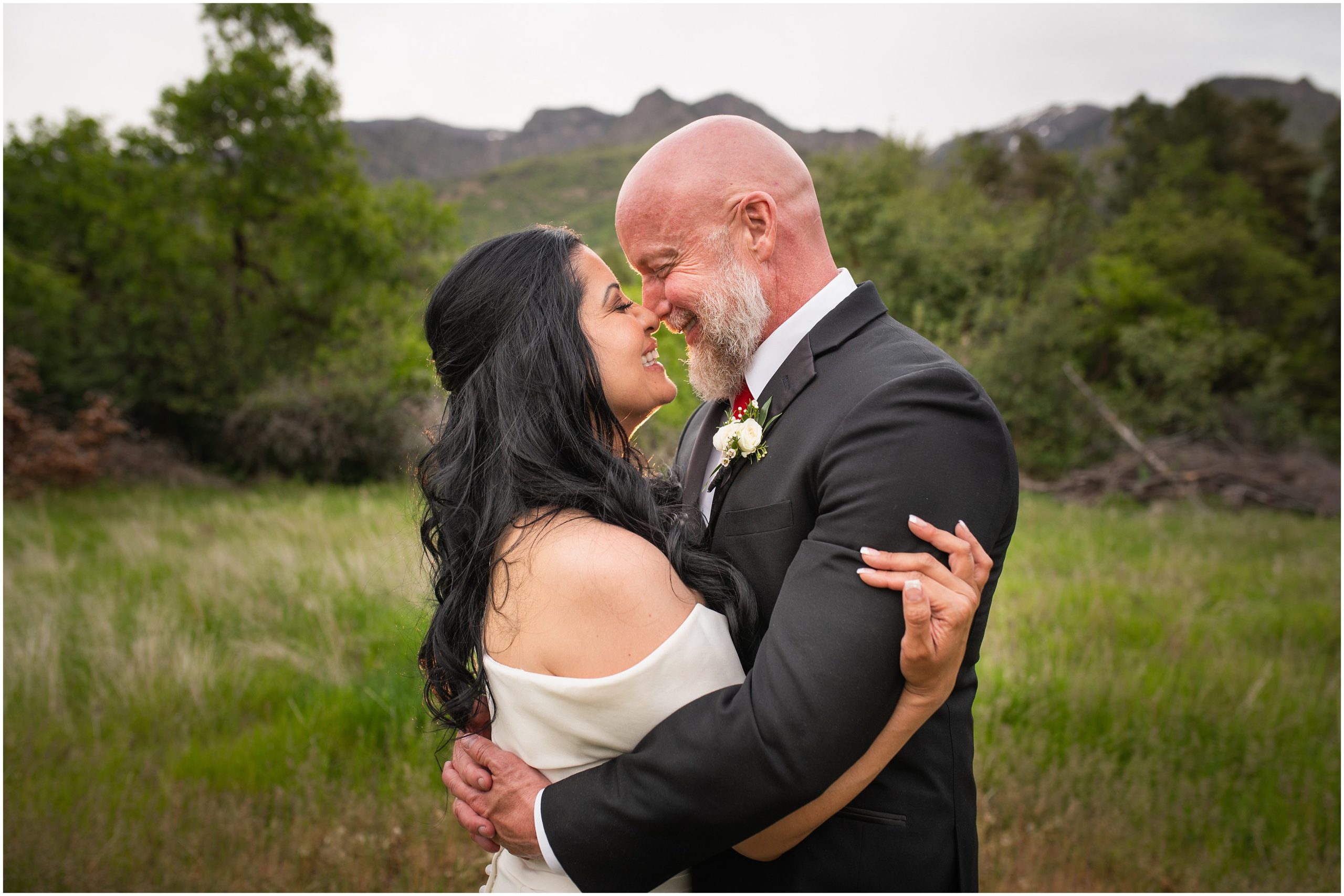 Bride and groom portraits in woods surrounded by Utah Mountains | Red and Black Oak Hills Utah Spring Wedding | Jessie and Dallin Photography