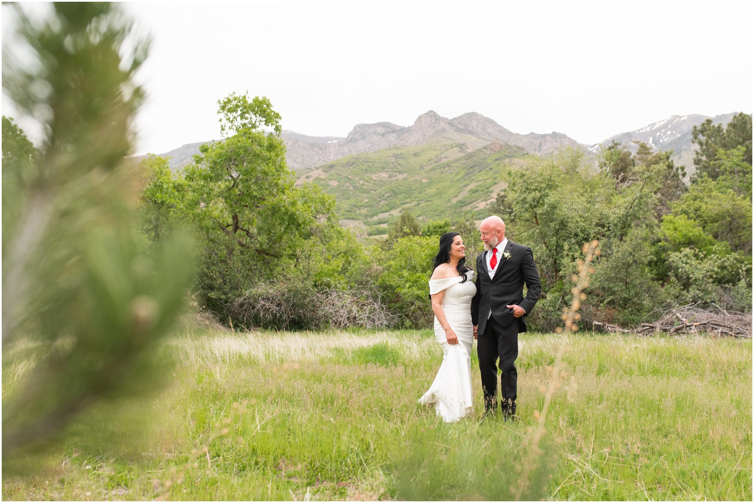 Bride and groom portraits in woods surrounded by Utah Mountains | Red and Black Oak Hills Utah Spring Wedding | Jessie and Dallin Photography