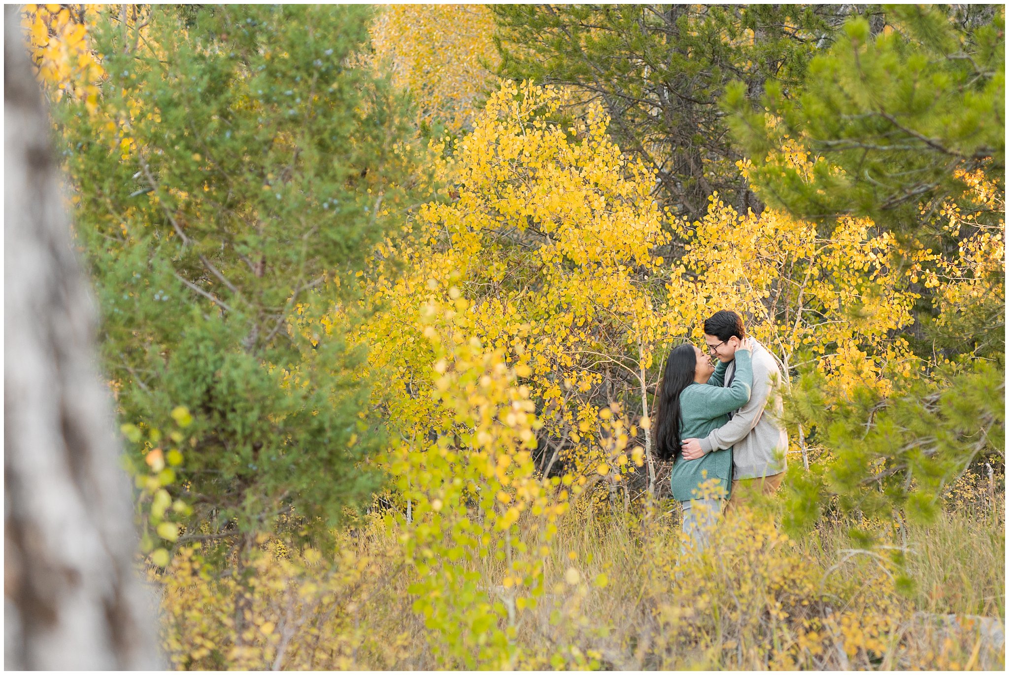 Couple dressed in casual sweaters in the Utah mountains in the fall | Tibble Fork Fall Engagement Session | Jessie and Dallin Photography