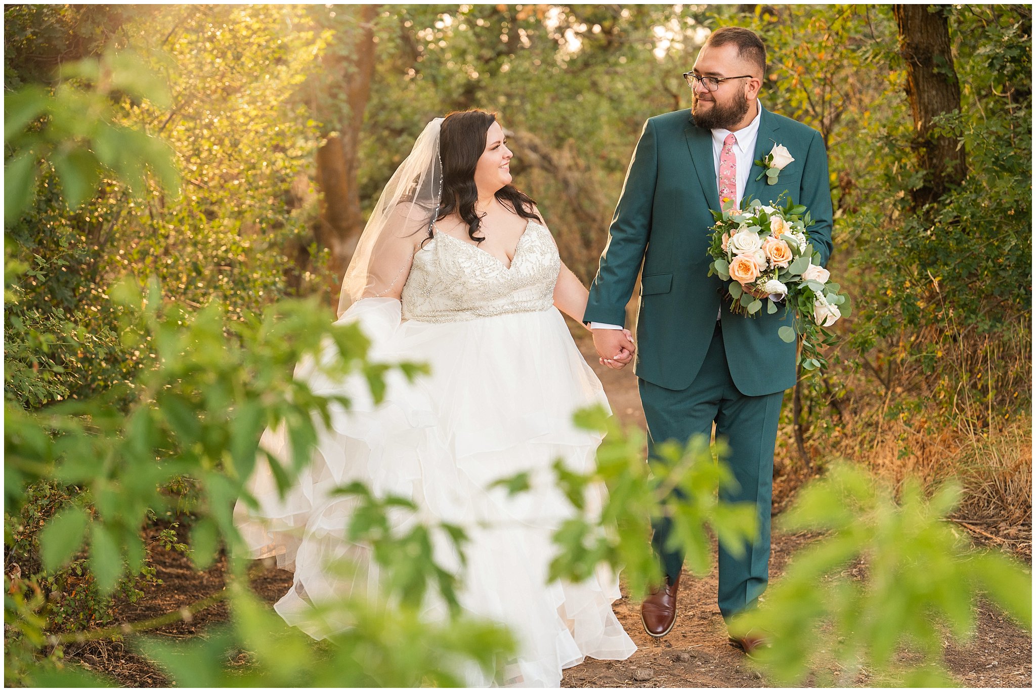 Bride and groom in green suit candid portraits in a forest | Green and Salmon Pink Utah Wedding | Oak Hills | Jessie and Dallin Photography