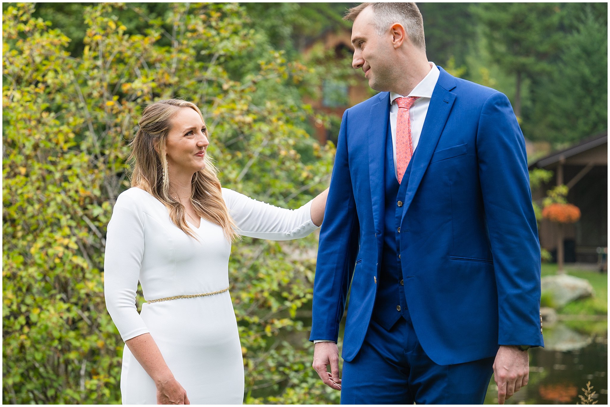 Bride and groom in exchange gifts and have first look in the forest of Montana by a pond | Mountainside Weddings Kalispell Montana Destination Wedding | Jessie and Dallin Photography