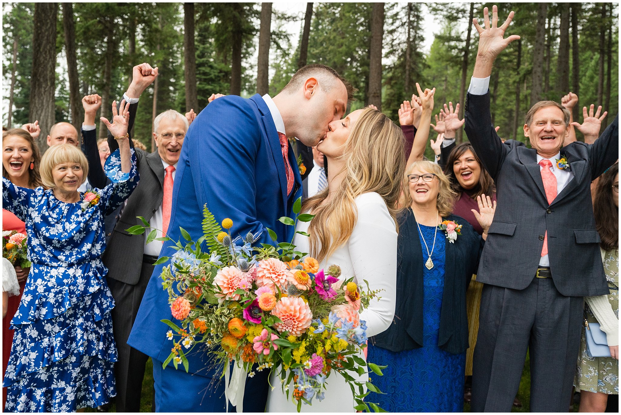 Family and the bride and groom celebrate after ceremony in the Montana forest | Mountainside Weddings Kalispell Montana Destination Wedding | Jessie and Dallin Photography