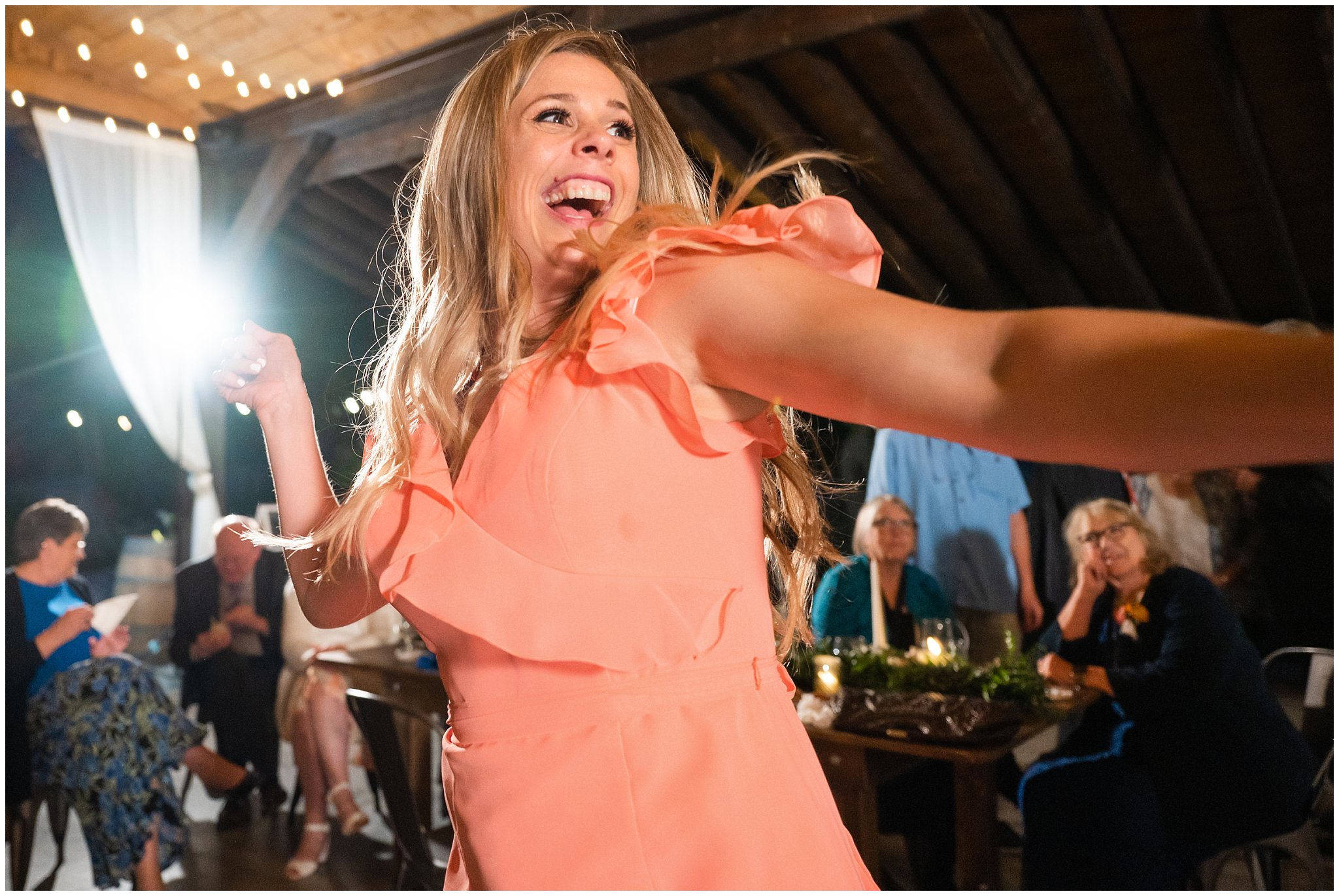 Dancing and reception under pavilion in the forest with draping lights and chandeliers | Mountainside Weddings Kalispell Montana Destination Wedding | Jessie and Dallin Photography