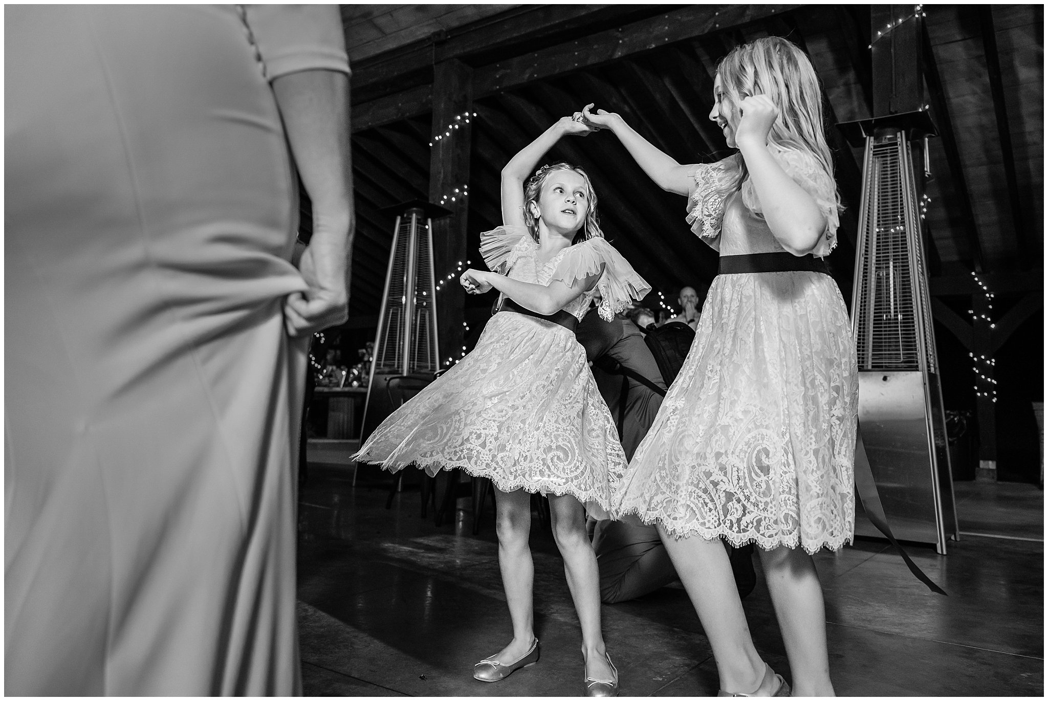 Dancing and reception under pavilion in the forest with draping lights and chandeliers | Mountainside Weddings Kalispell Montana Destination Wedding | Jessie and Dallin Photography