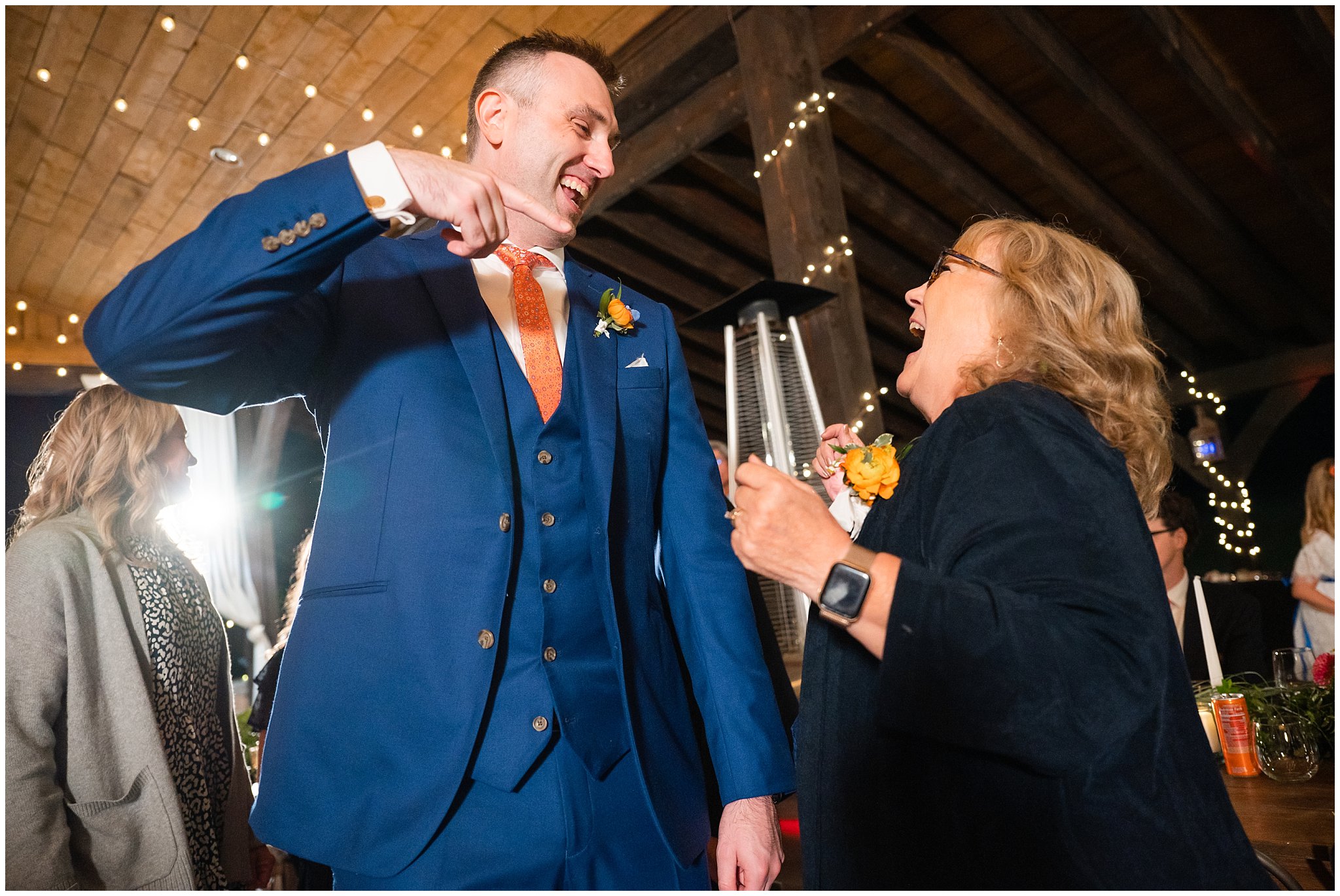 Dancing and reception under pavilion in the forest with draping lights and chandeliers | Mountainside Weddings Kalispell Montana Destination Wedding | Jessie and Dallin Photography