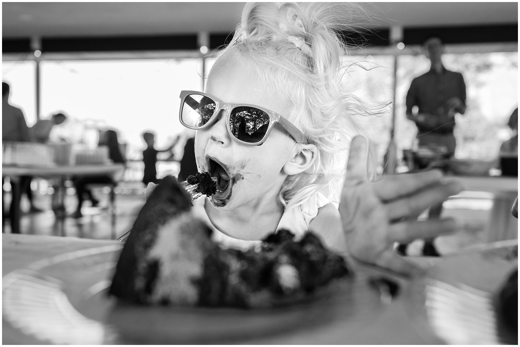 Award winning image of girl eating chocolate cake at wedding | Intimate Utah Summer Garden Wedding | Jessie and Dallin Photography