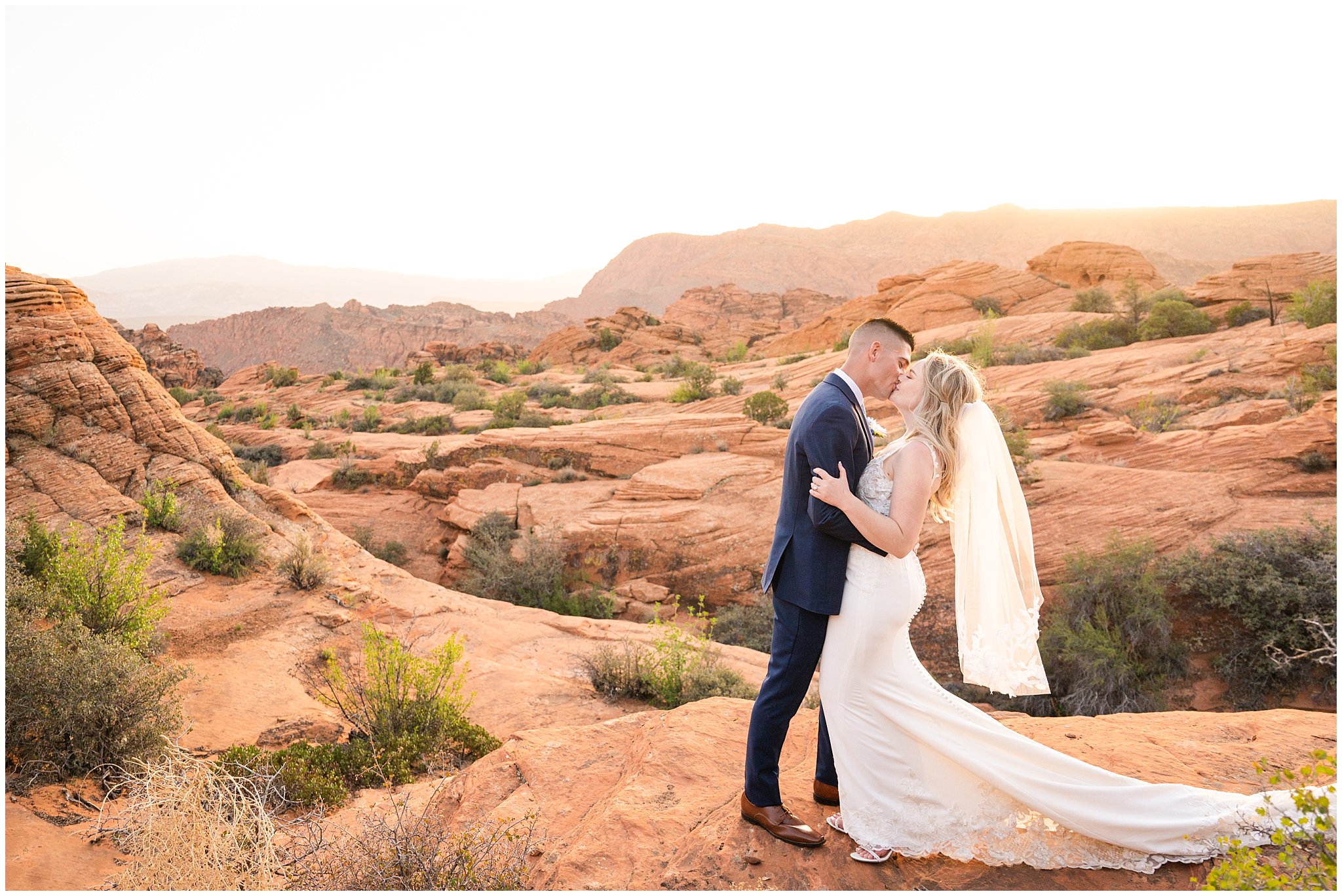 Wedding in the red rocks of southern Utah. Bride and groom wedding day portraits in the red rock.