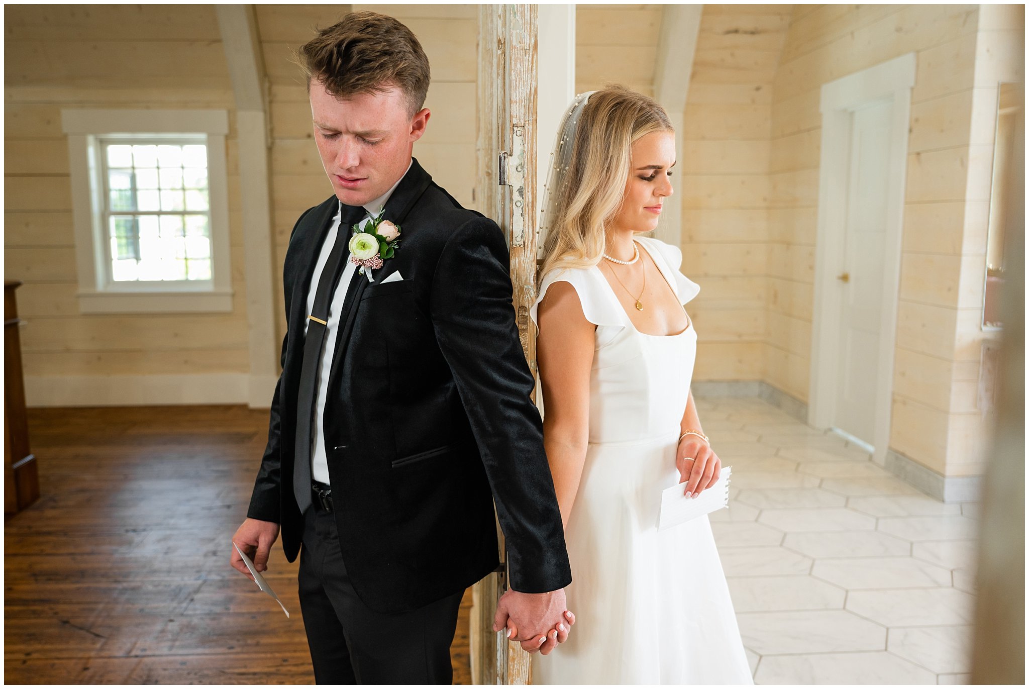 Bride and groom share first touch and reading vows together at Walker Farms