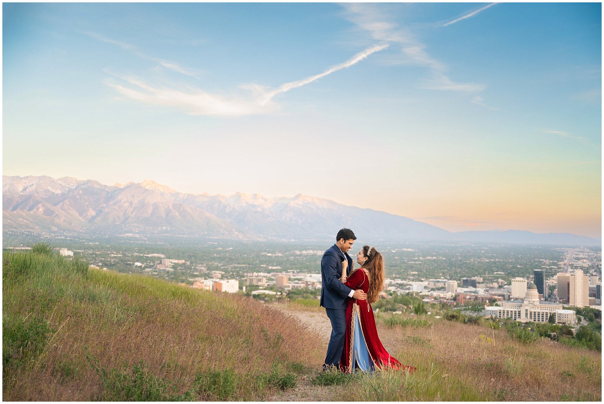 Couple in the mountains at sunset in Utah overlooking Salt Lake City | Moroccan-inspired Utah State Capitol sunset wedding formal session