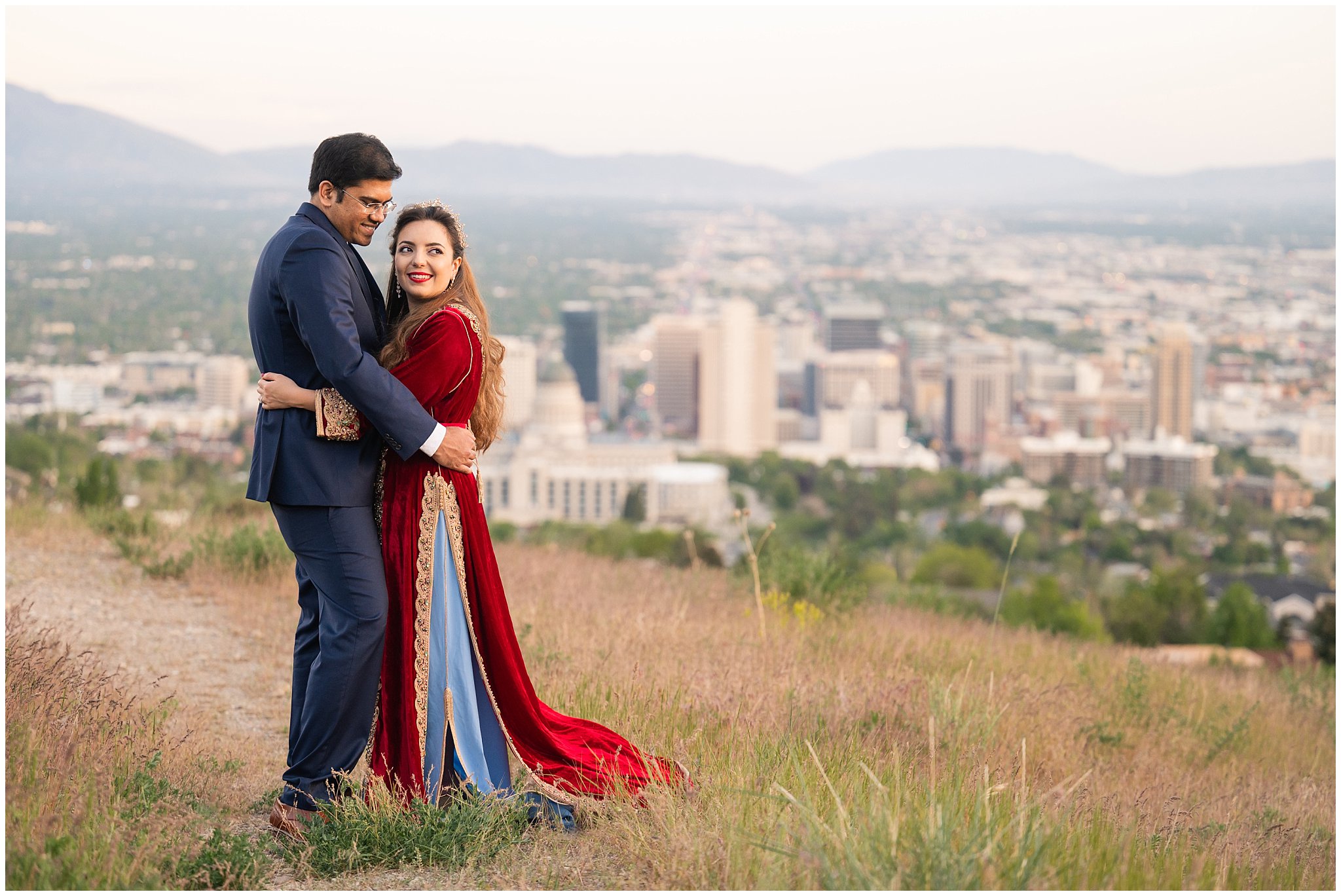 Couple in the mountains at sunset in Utah overlooking Salt Lake City | Moroccan-inspired Utah State Capitol sunset wedding formal session