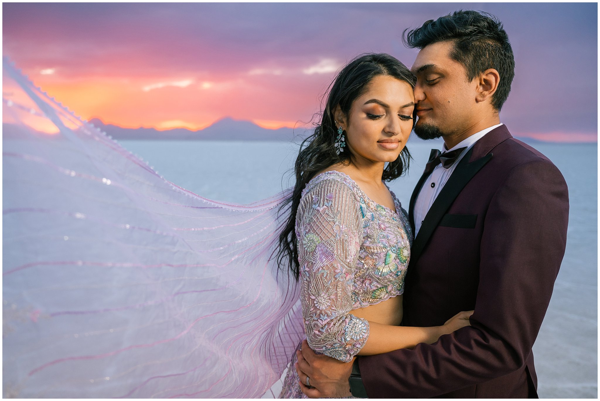 Couple together at sunset during their Indian wedding session at the Bonneville Salt Flats