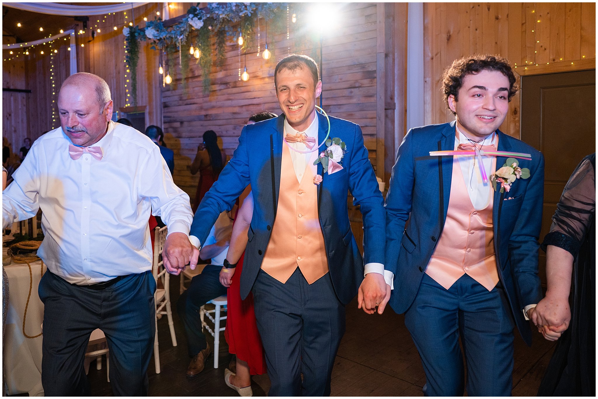 Bride and groom dance with guests hava nagila during reception in a barn | Oak Hills Utah Destination Wedding | Jessie and Dallin Photography