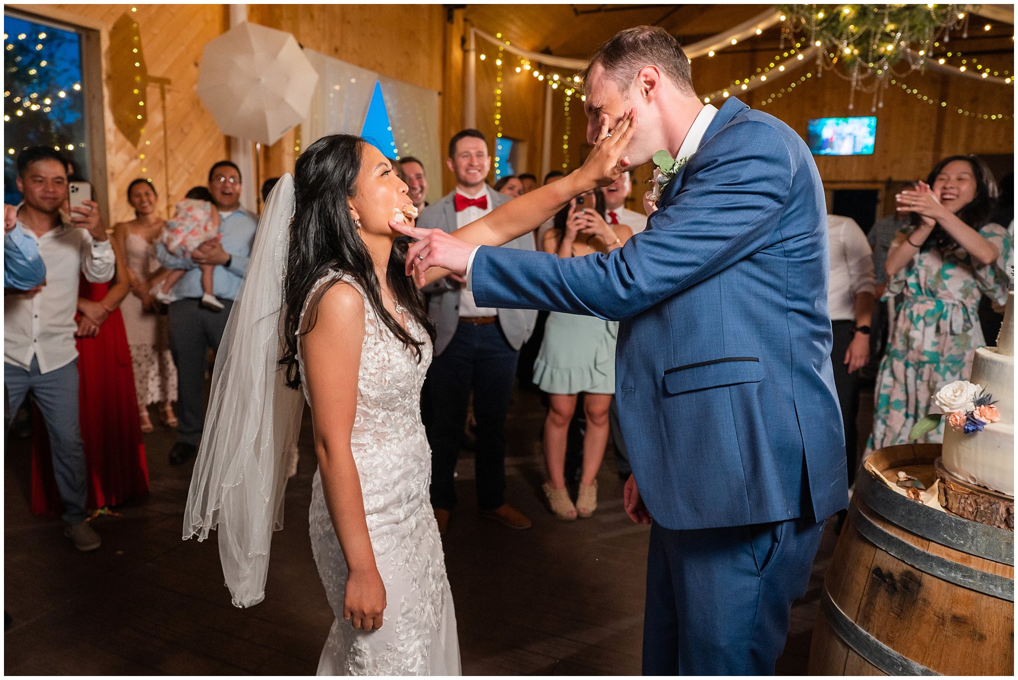 Cake cutting during reception in a barn | Oak Hills Utah Destination Wedding | Jessie and Dallin Photography