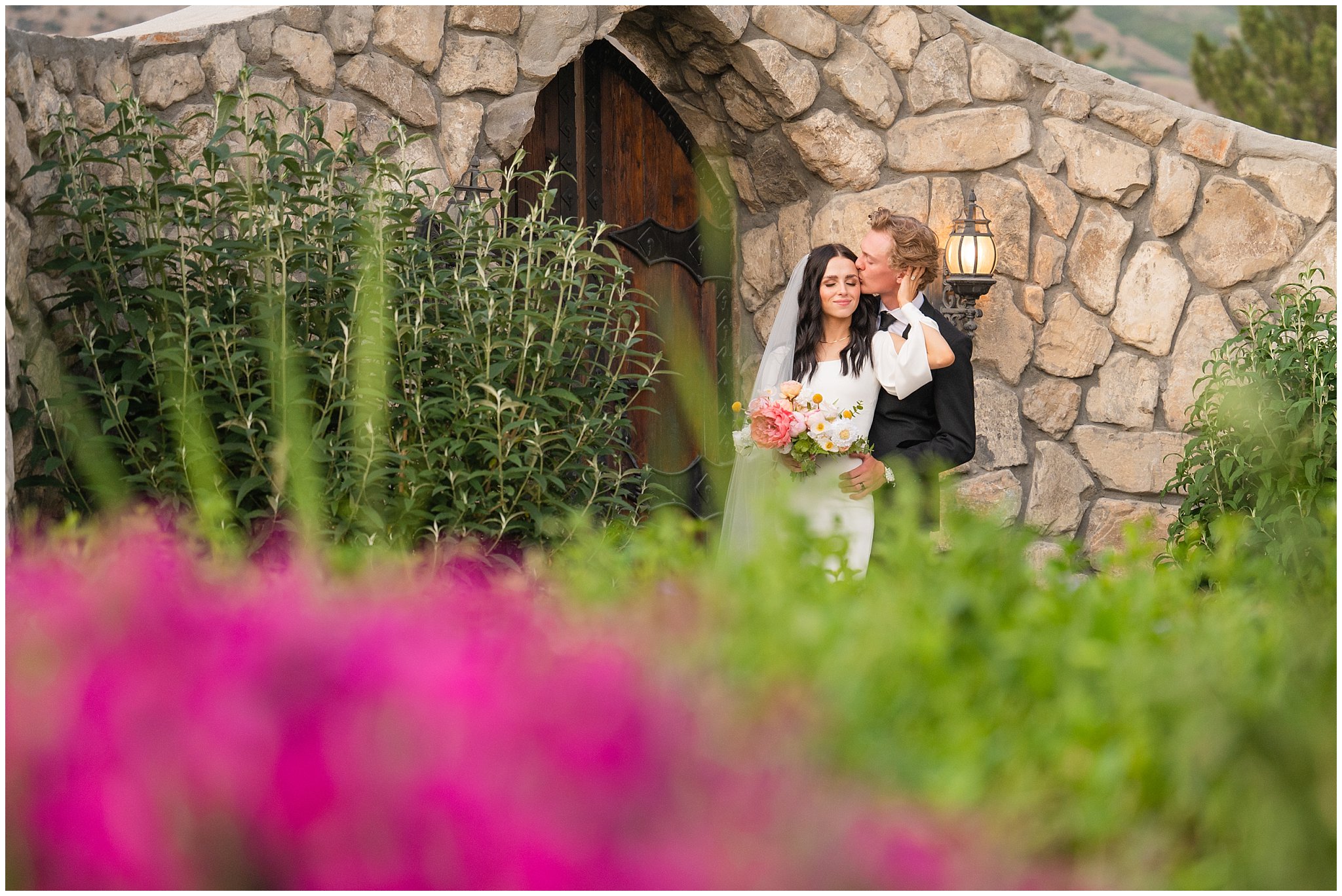 Bride and groom portraits outside of castle wedding venue with black and white and pink wedding colors | Draper Temple and Wadley Farms Summer Castle Wedding | Jessie and Dallin Photography