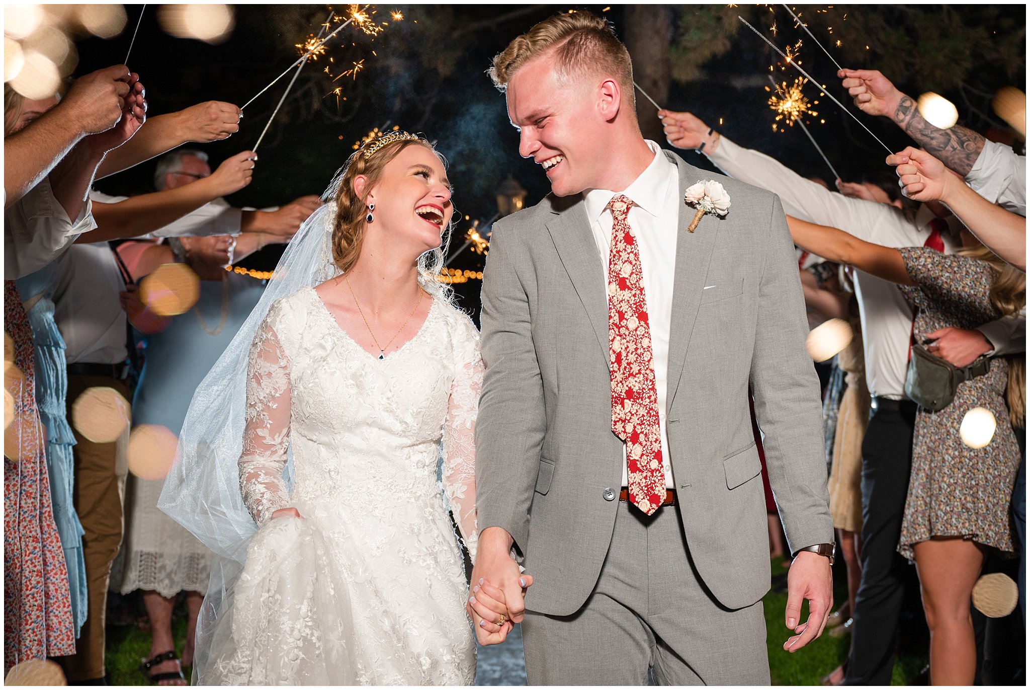 Bride and groom laughing and having fun during sparkler sendoff at Eldredge Manor | Bountiful Temple and Eldredge Manor Wedding | Jessie and Dallin Photography