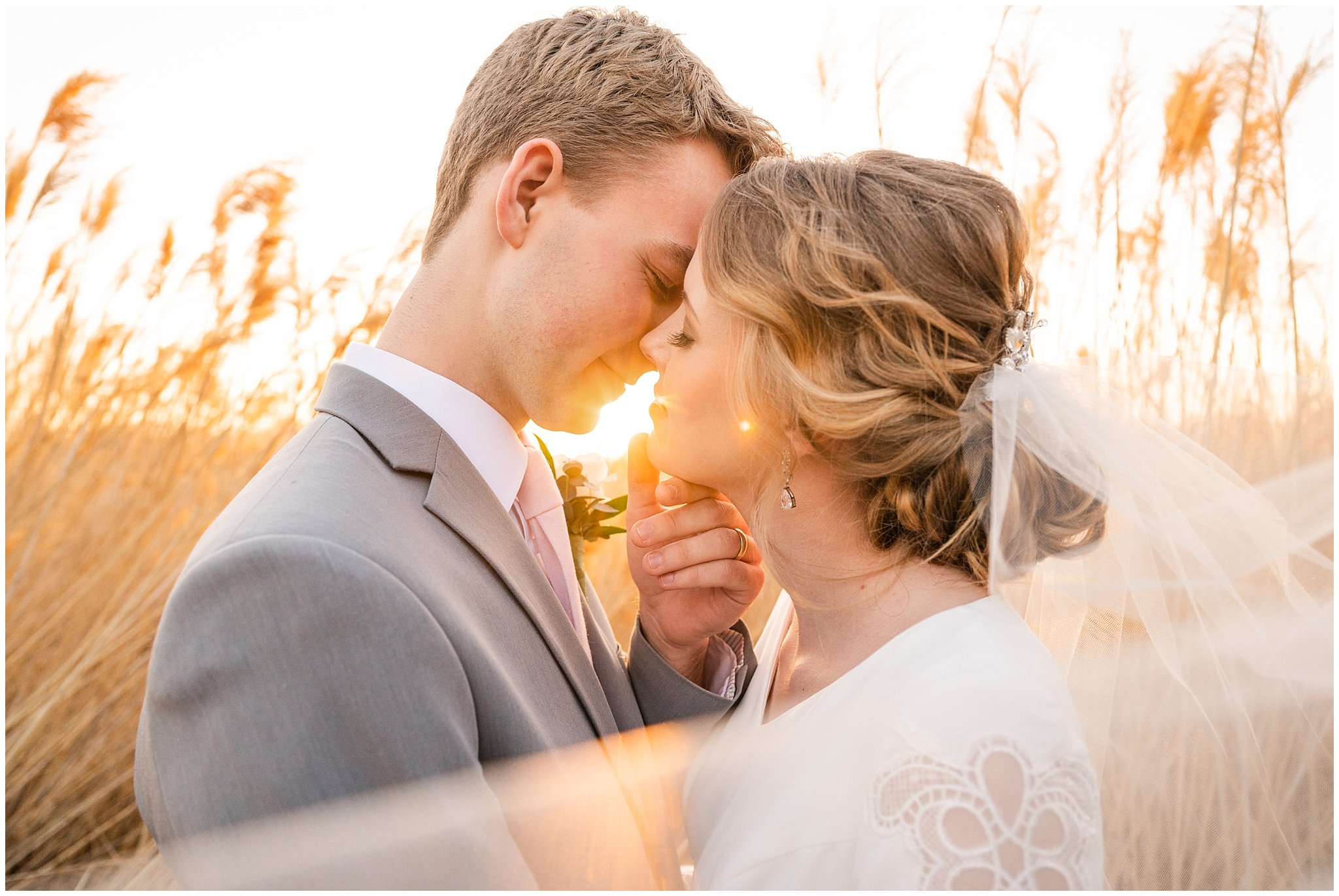 Bride and groom sharing a kiss at golden hour surrounded by beautiful light | Bountiful Temple and Tunnel Springs Formal Session | Jessie and Dallin Photography