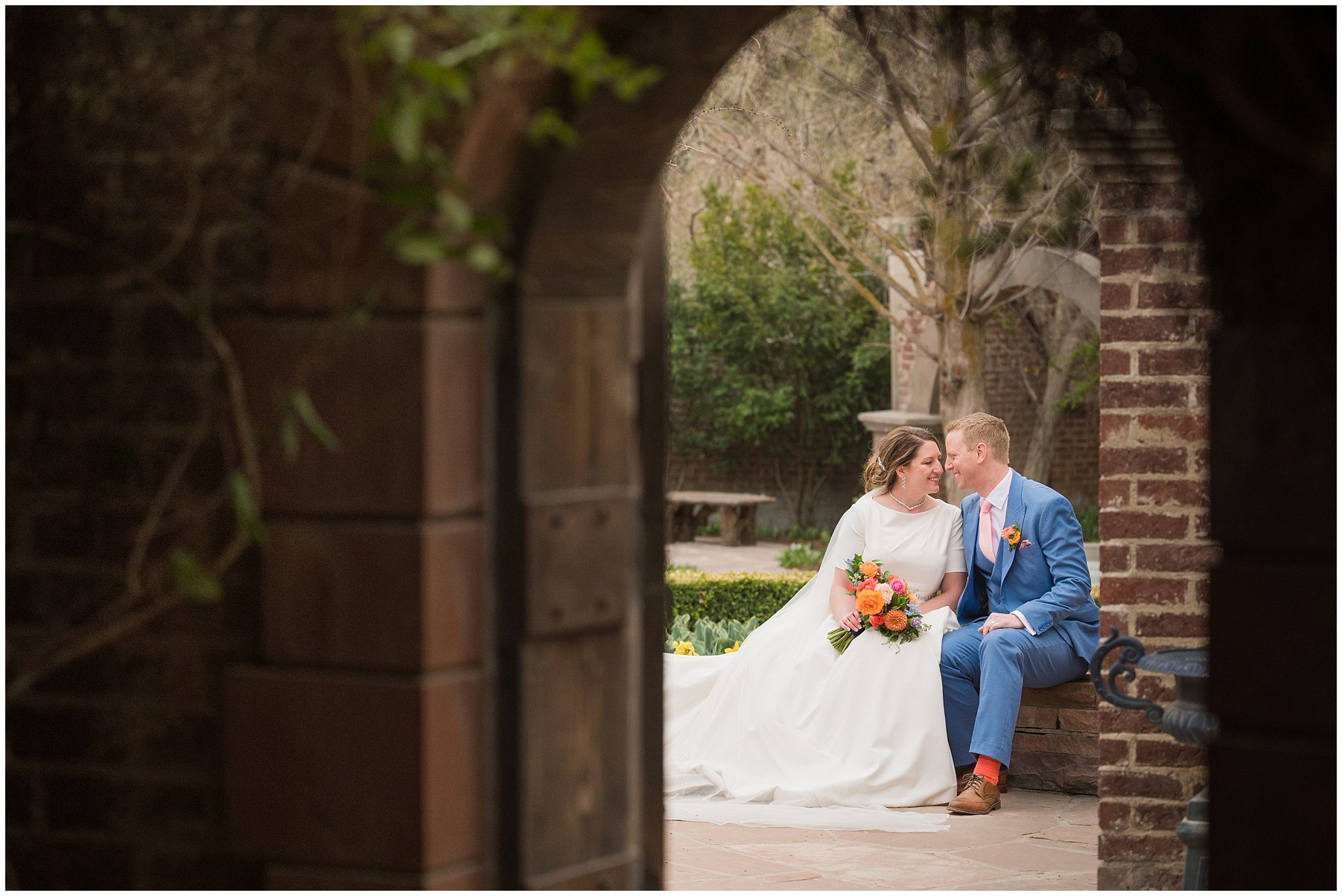 Bride and groom sitting in The Secret Garden | Thanksgiving Point Rainy Spring Formal Session | Jessie and Dallin Photography