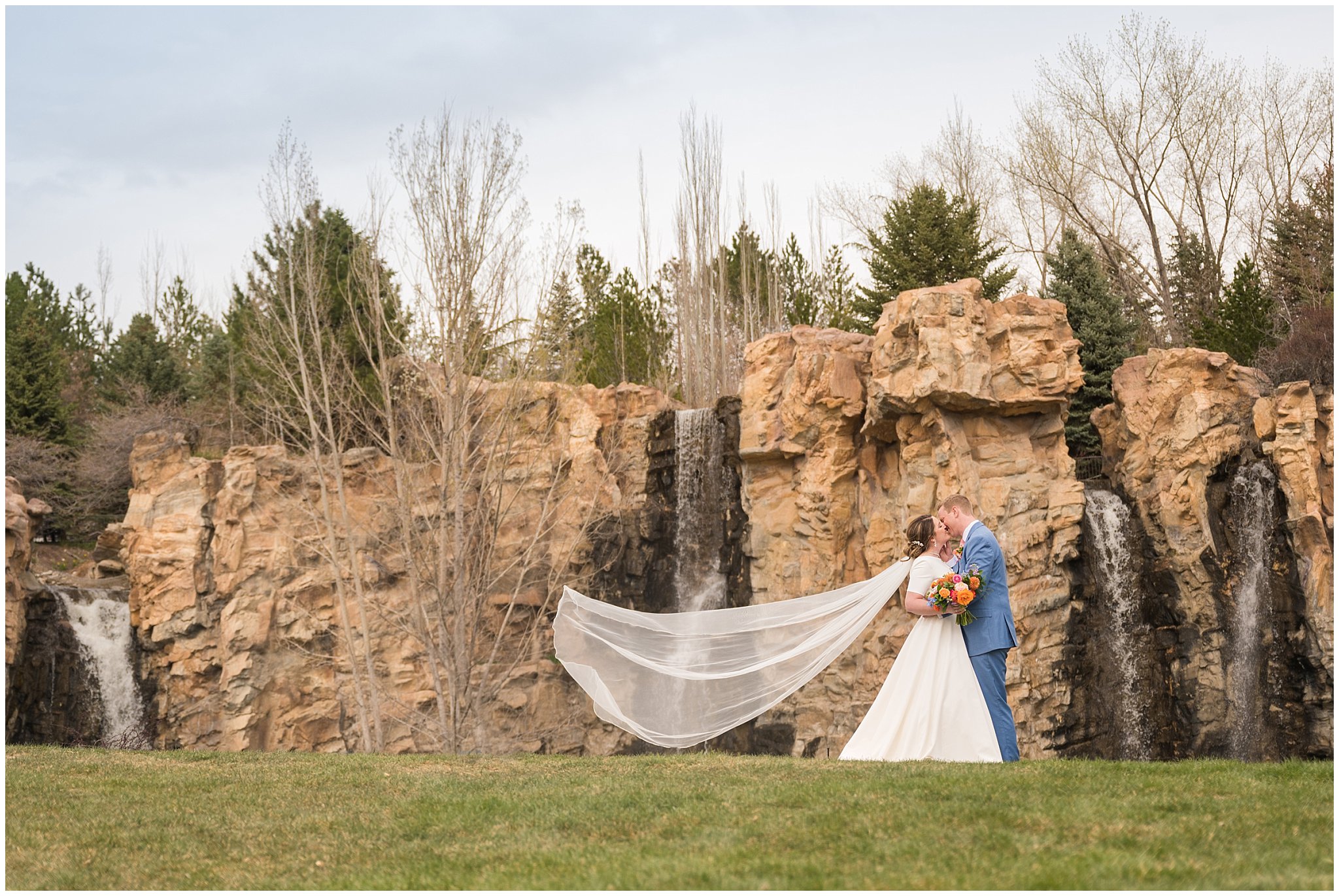 Bride and groom portraits at the waterfall in the gardens at Thanksgiving Point | Thanksgiving Point Rainy Spring Formal Session | Jessie and Dallin Photography