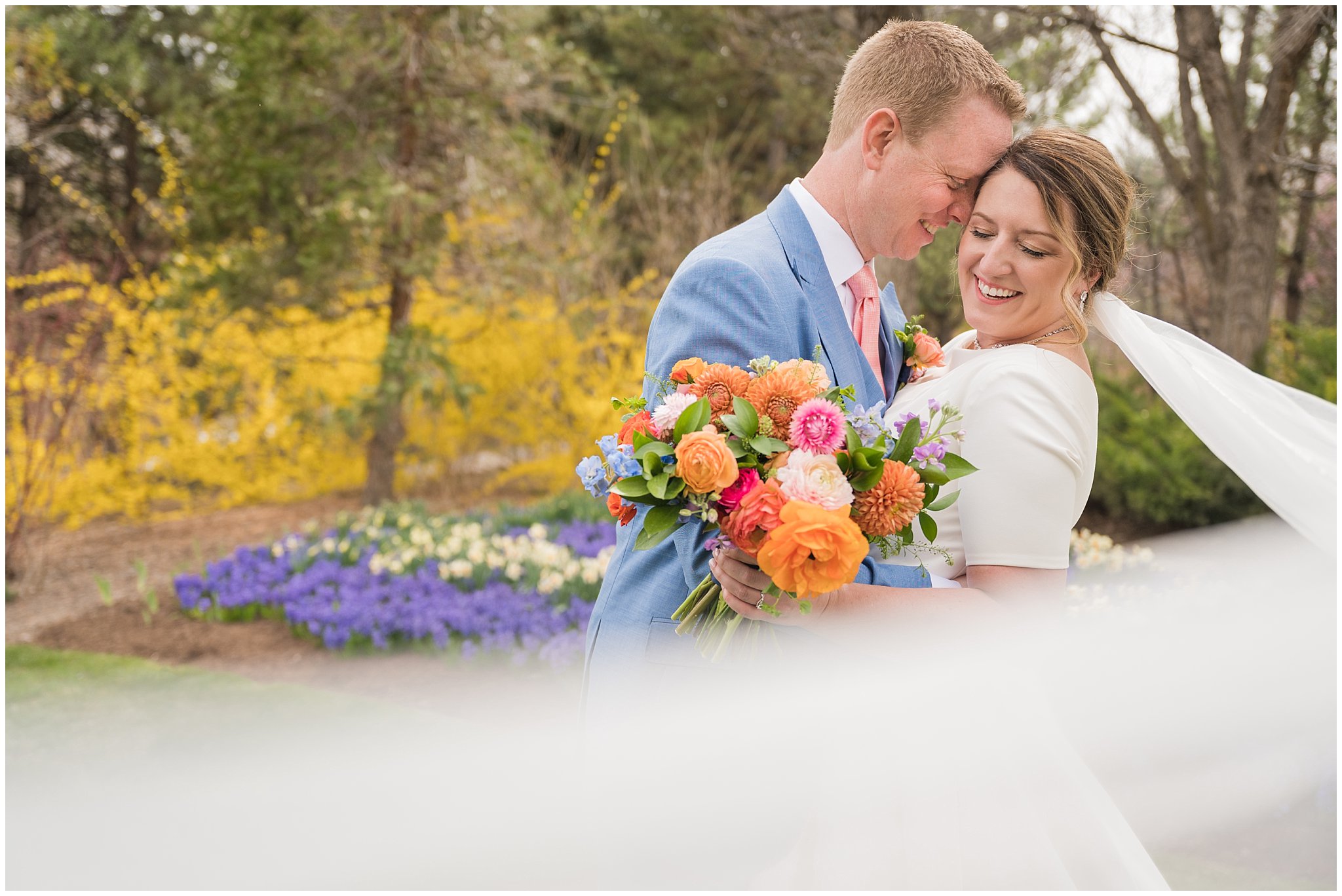 Bride and groom portraits with the tulips in the gardens at Thanksgiving Point | Thanksgiving Point Rainy Spring Formal Session | Jessie and Dallin Photography