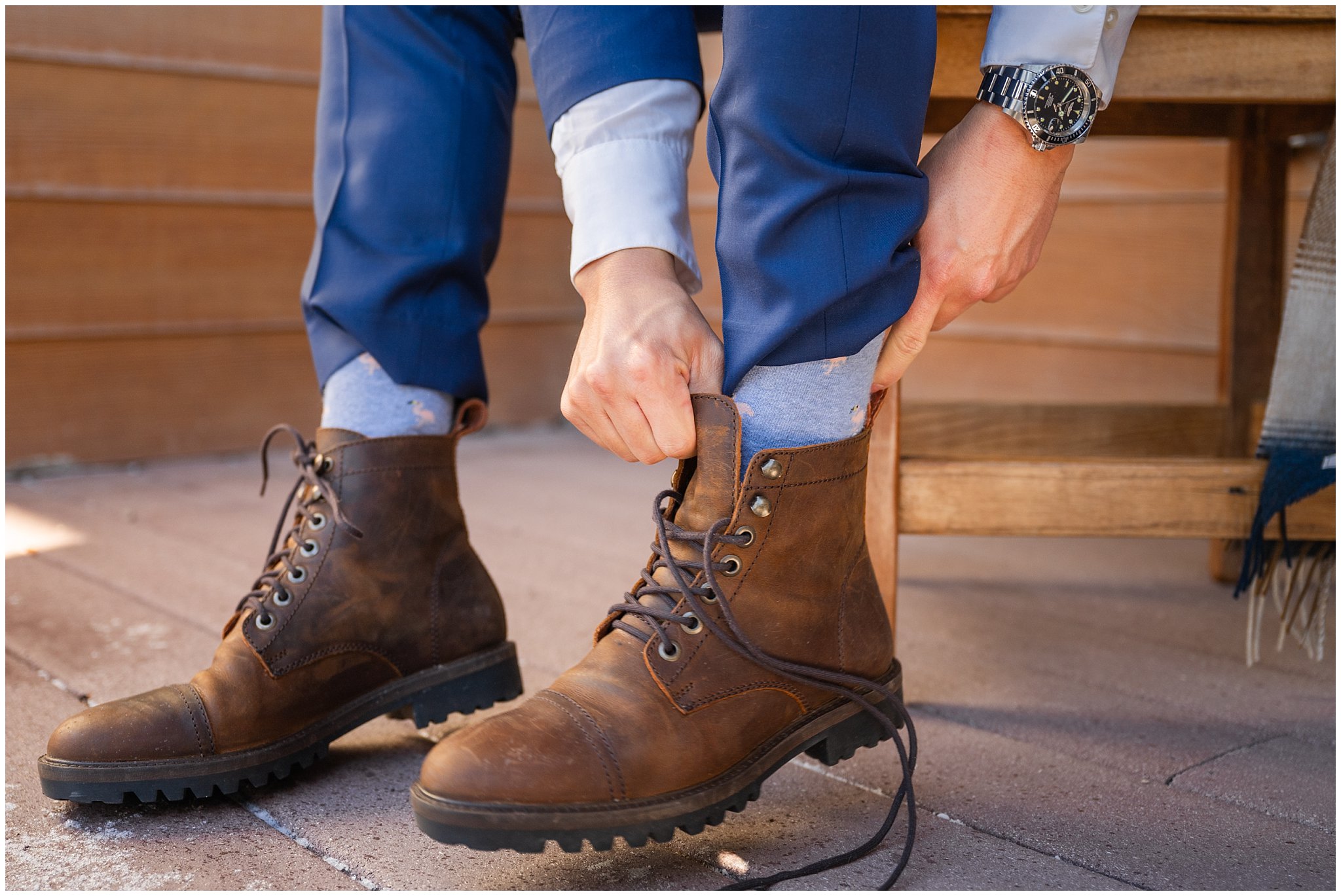 Groom putting on boots for snowy wedding day | Snowbasin Resort Winter Wedding | Jessie and Dallin Photography