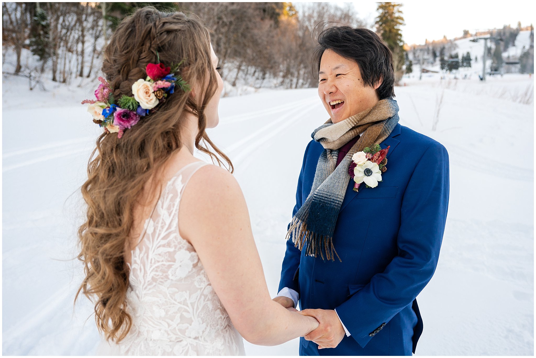 Bride and groom share a first look in the snow outside of Needles Lodge | Snowbasin Resort Winter Wedding | Jessie and Dallin Photography