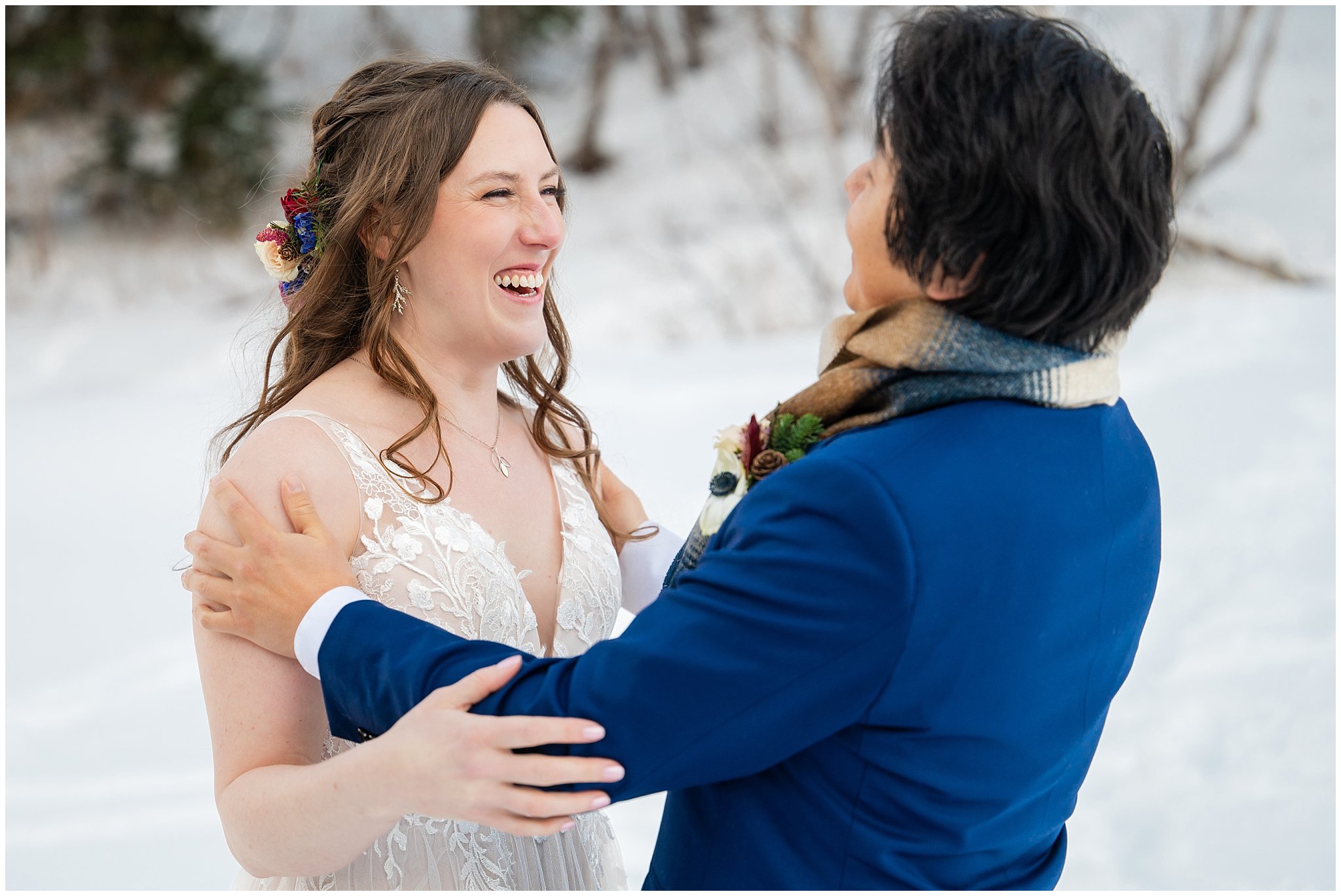 Bride and groom share a first look in the snow outside of Needles Lodge | Snowbasin Resort Winter Wedding | Jessie and Dallin Photography