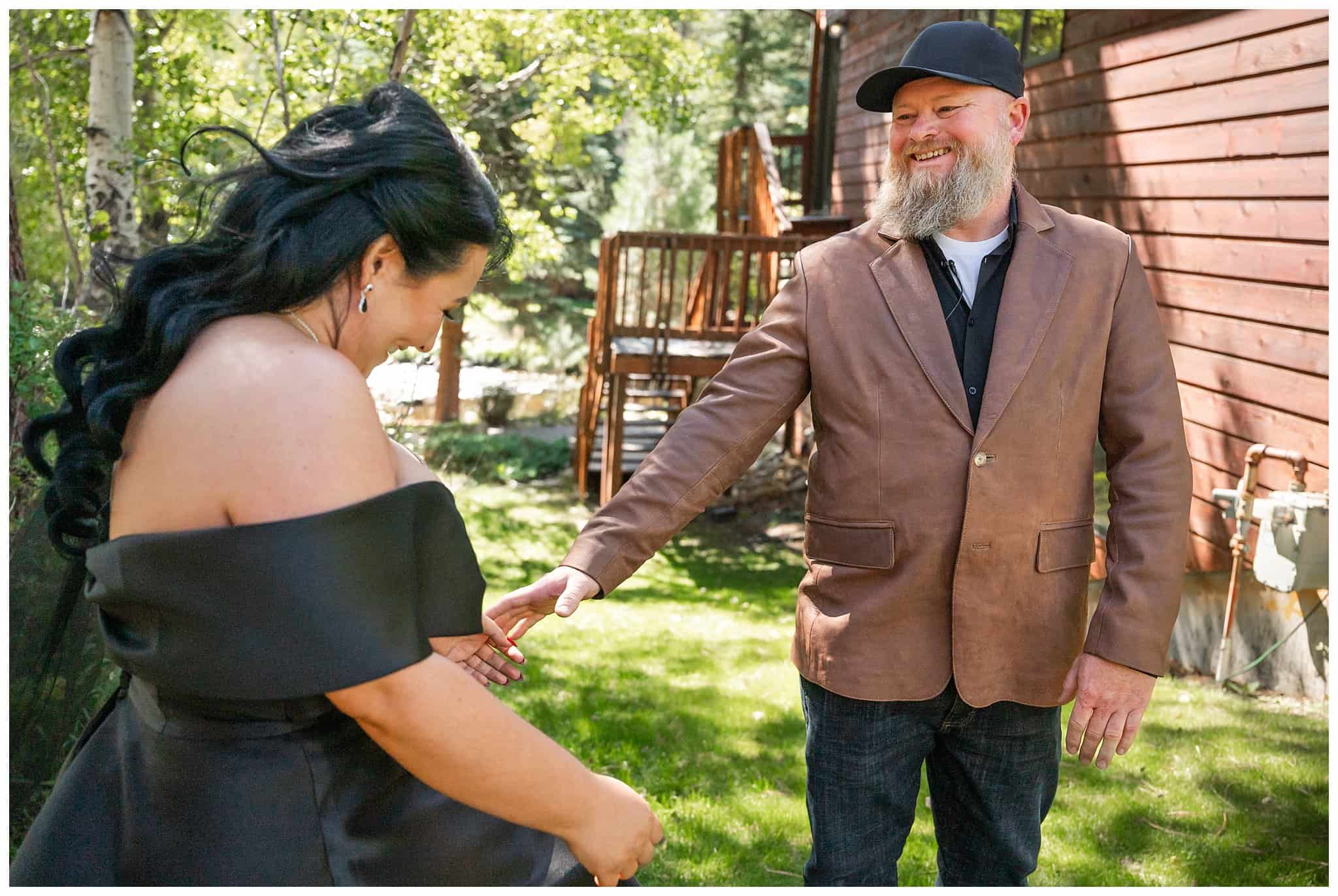 Bride and groom share a first look outside at Boulder Brook on Fall River in Estes Park | Fall Rocky Mountain National Park Elopement | Jessie and Dallin Photography