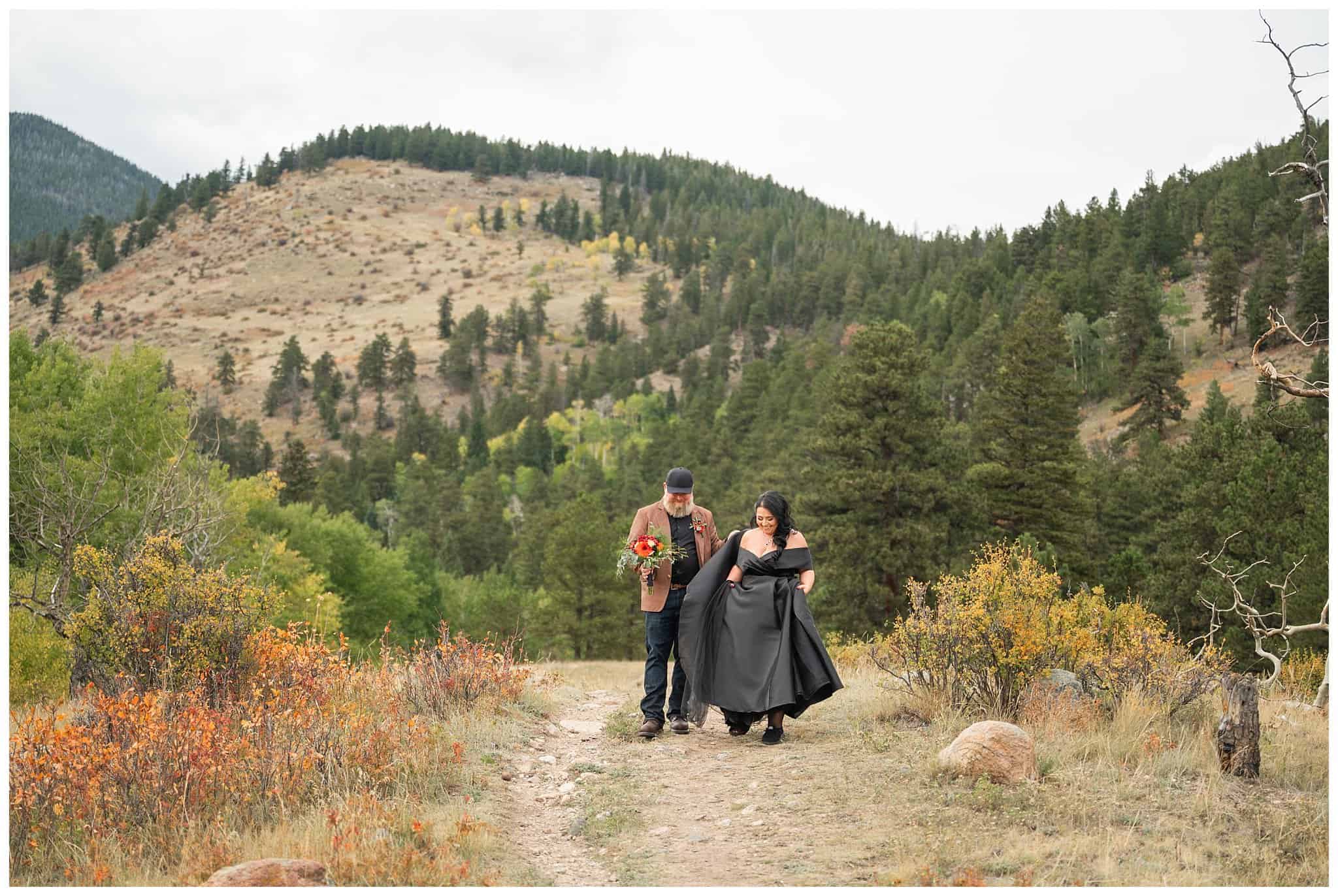 Bride in black dress and groom in brown leather jacket sharing moments at Rocky National Park | Fall Rocky Mountain National Park Elopement | Jessie and Dallin Photography