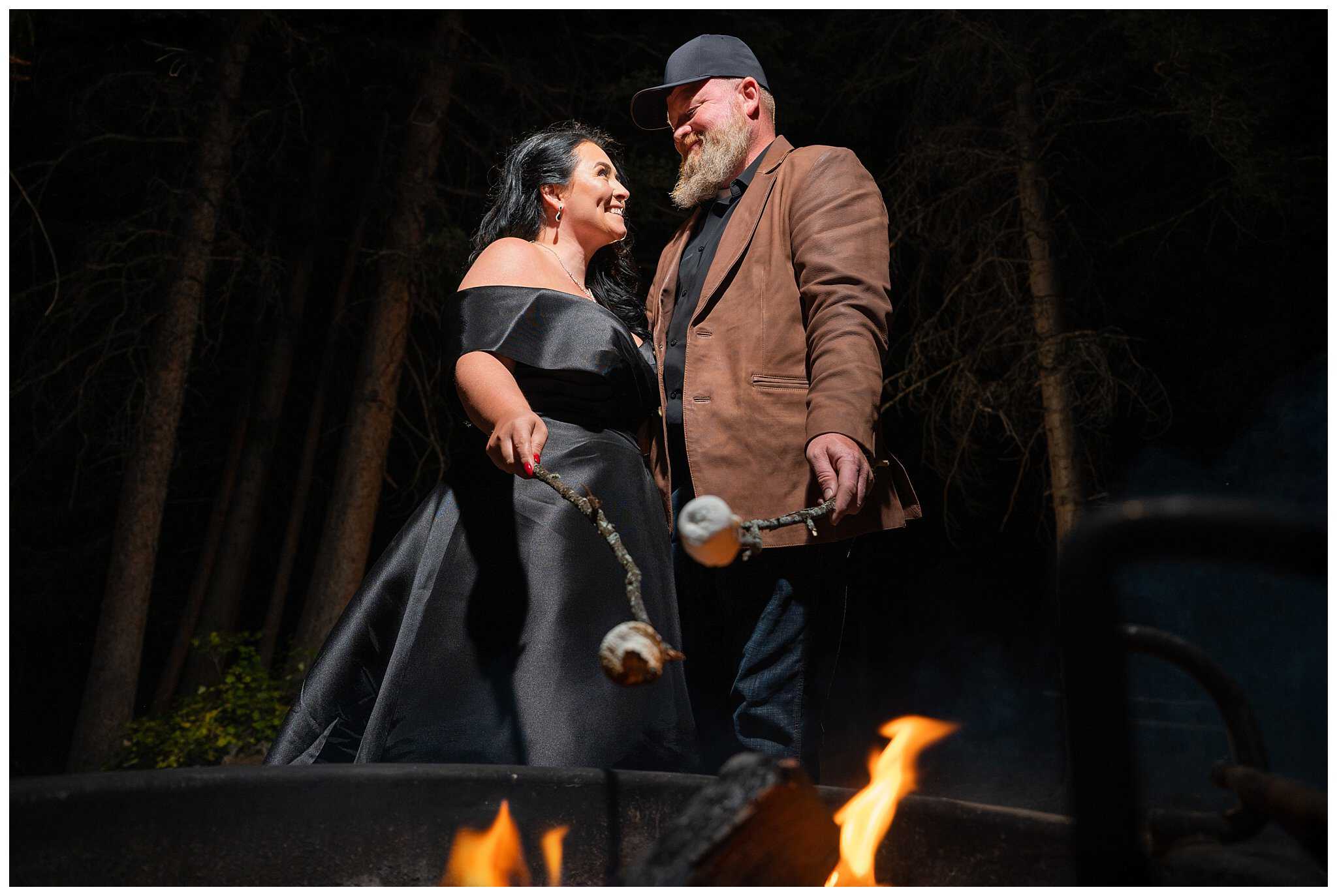 Bride and groom make smores over the campfire at Rocky National Park | Fall Rocky Mountain National Park Elopement | Jessie and Dallin Photography