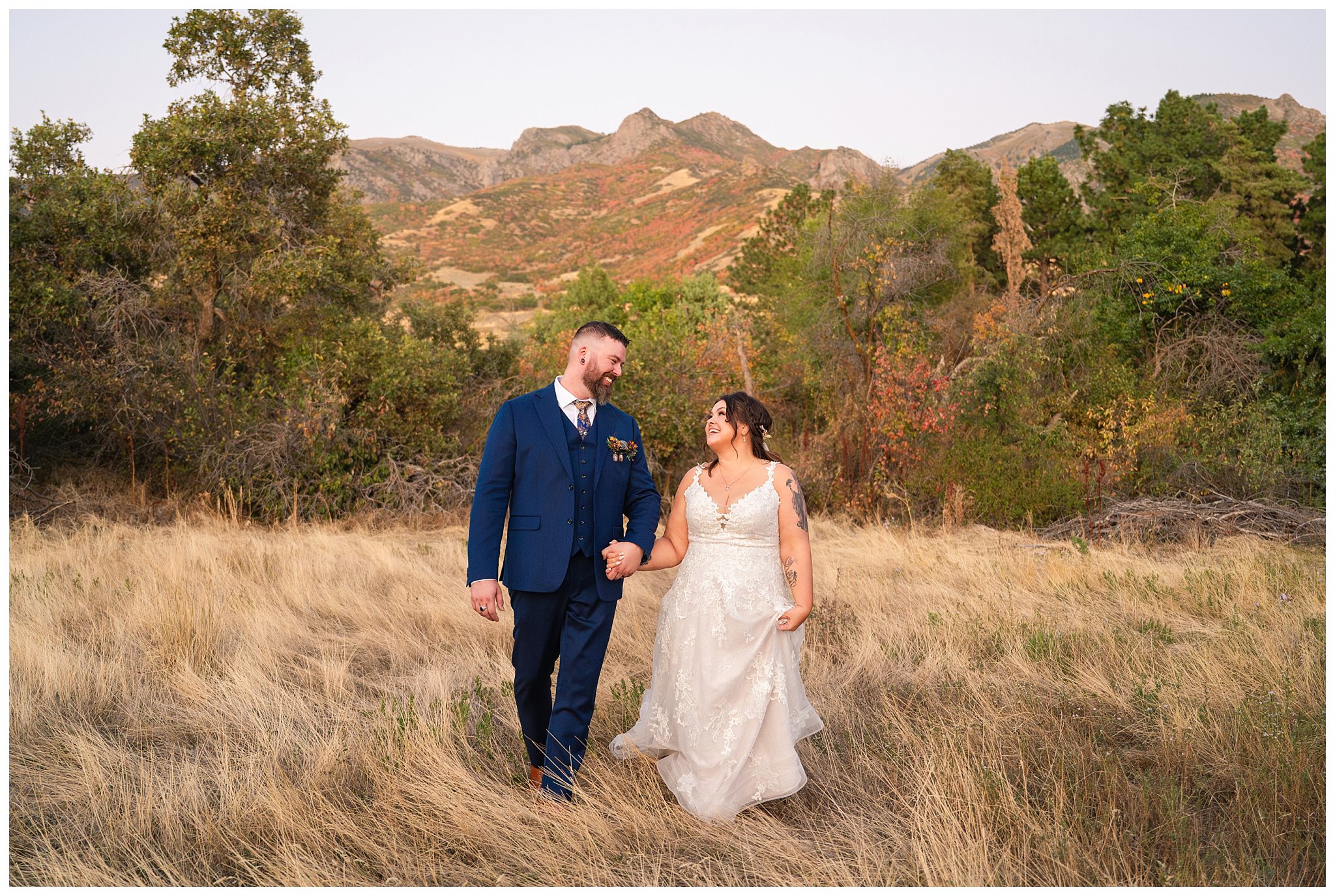 Bride and groom portraits with the mountain view at Oak HIlls at sunset. Bride in lace dress and long veil and groom in custom blue suit with Star Wars details | Star Wars Themed Wedding at Oak Hills Utah | Jessie and Dallin Photography