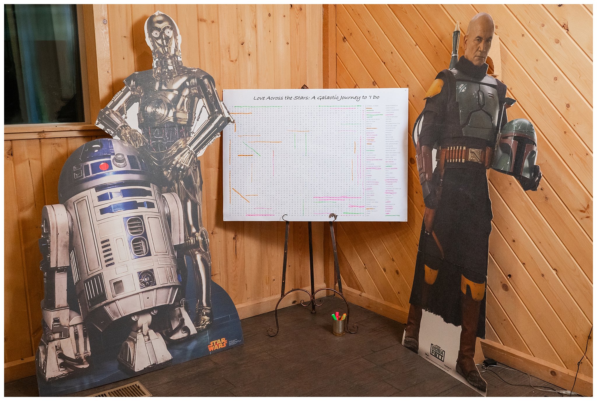 Reception Star Wars details. R2D2, C3PO, and Boba Fett cardboard cutouts and giant Star Wars wordsearch for guests | Star Wars Themed Wedding at Oak Hills Utah | Jessie and Dallin Photography