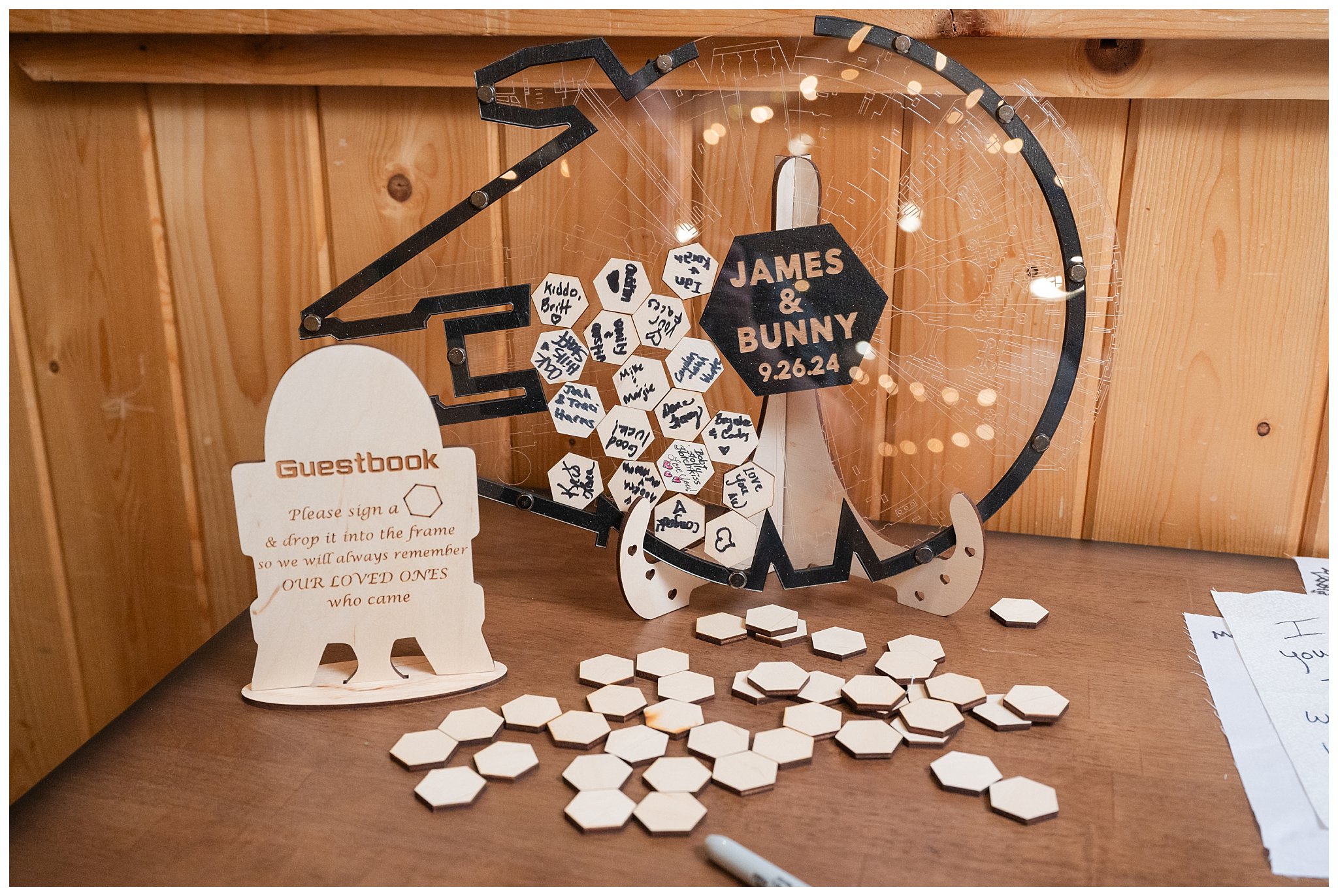 Reception Star Wars details. R2D2 guest book instructions, and Millennium Falcon wooden piece guest book | Star Wars Themed Wedding at Oak Hills Utah | Jessie and Dallin Photography