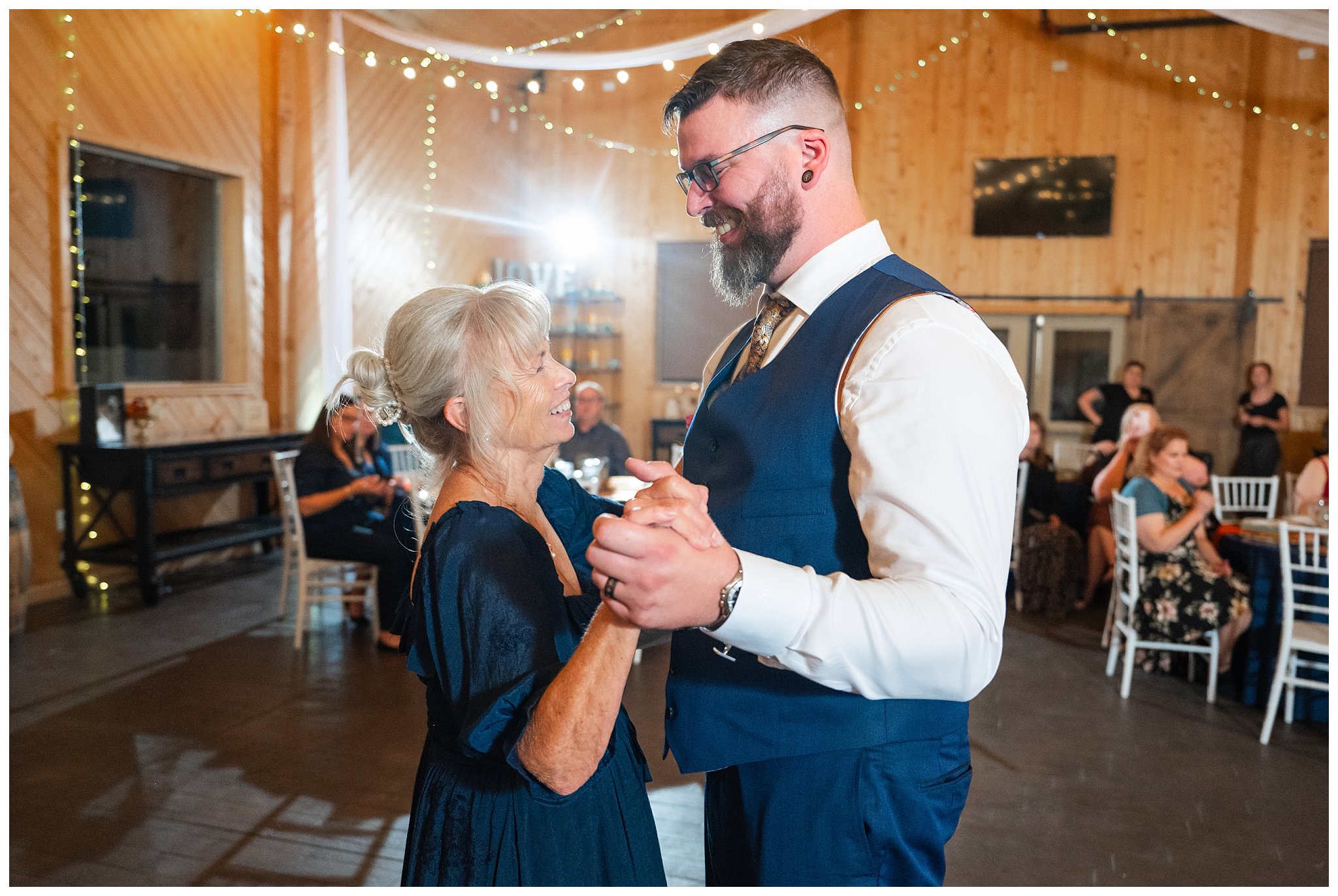 Groom shares a dance with the bride's mom in the barn at Oak Hills | Star Wars Themed Wedding at Oak Hills Utah | Jessie and Dallin Photography