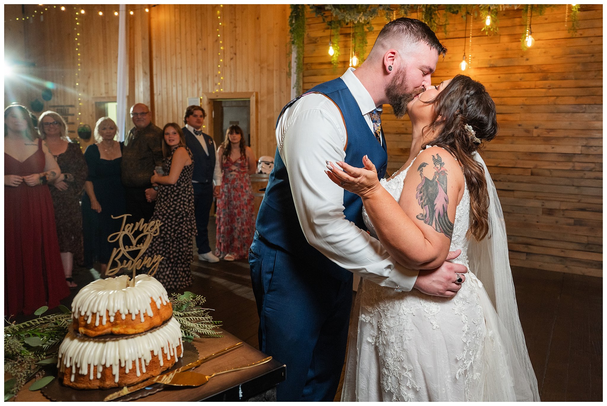 Cake cutting moments in the barn at Oak Hills | Star Wars Themed Wedding at Oak Hills Utah | Jessie and Dallin Photography